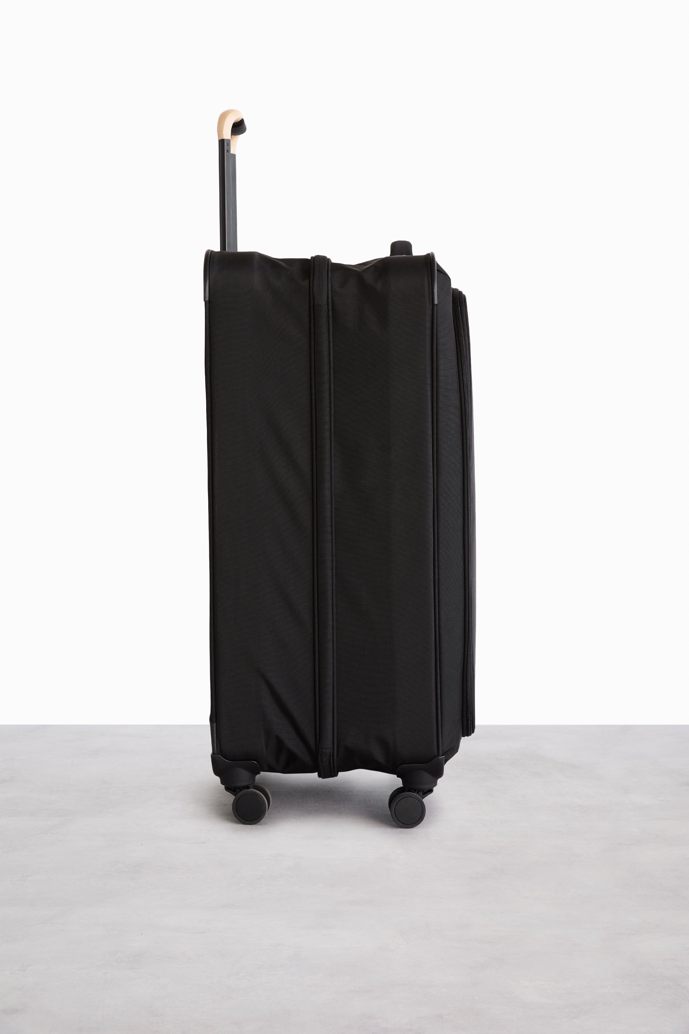 Soft Sided Collapsible Check In Roller Luggage - Black Expandable Carry On Suitcase for Travel, Business Trips & Weekend Getaways
