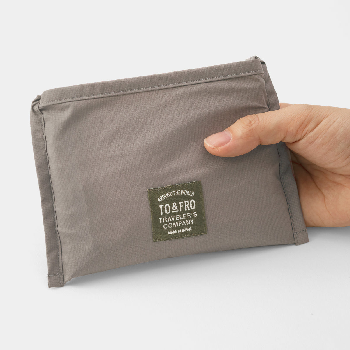 TRAVELER'S COMPANY Traveler's Factory x TO&FRO Waterproof Rain Bag in Warm Gray - Perfect for Outdoor Adventures, Commuting & Travel