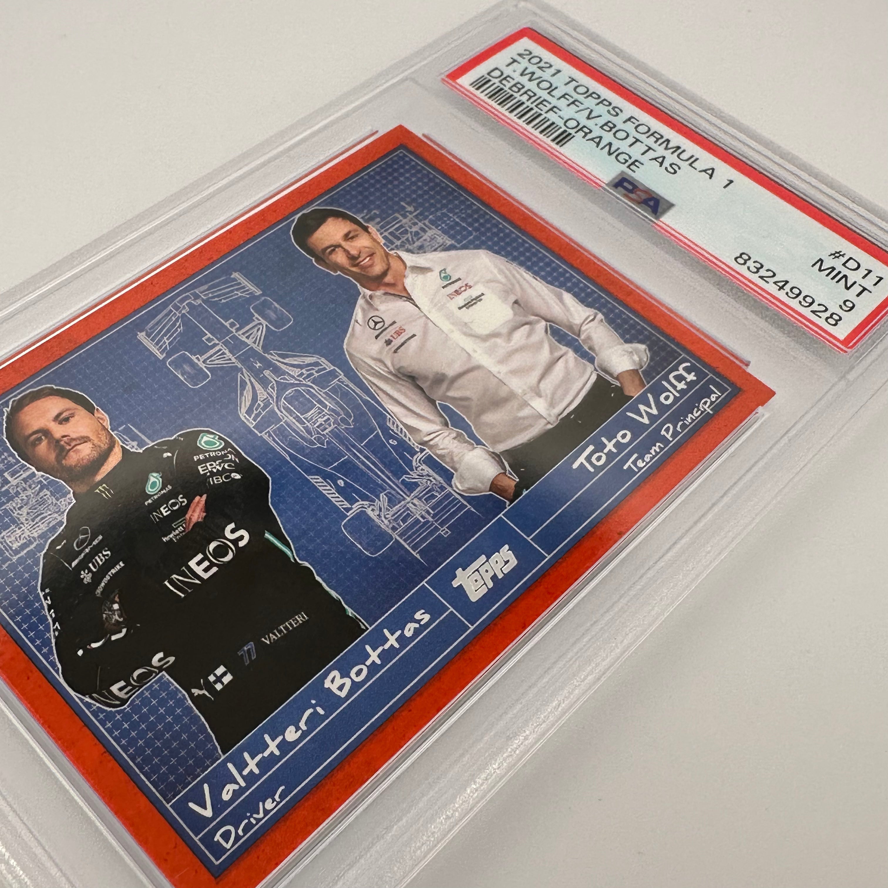 PSA 9 Graded 19/25 Valtteri Bottas & Toto Wolff Debrief #D11 Orange - Rare F1 Collectible for Motorsport Fans & Memorabilia Display