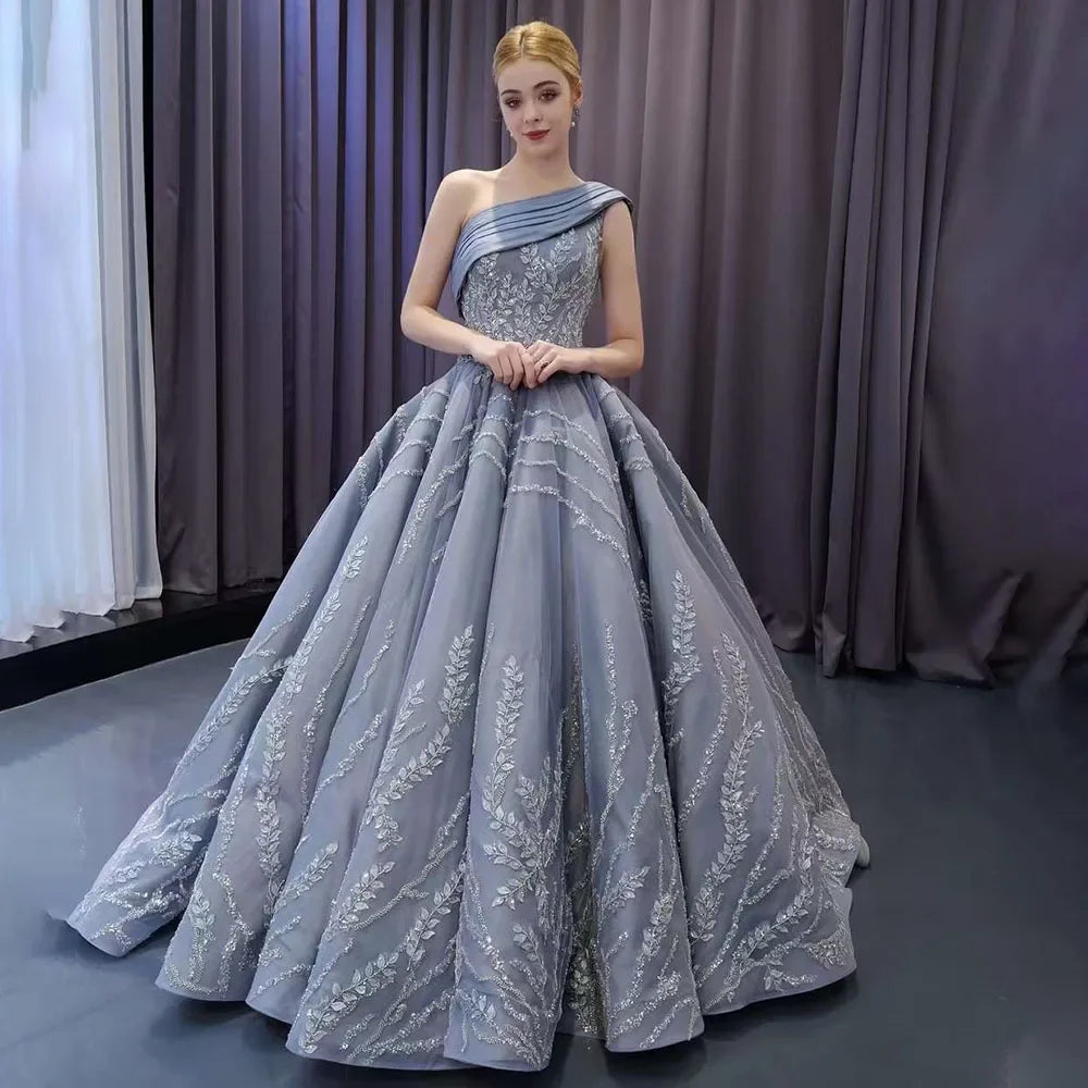 Serene Hill Gray One Shoulder Lace Up Beaded Luxury Ball Gown Wedding Dress 2025 | Custom Made Bridal Gown HM231074 | Perfect for Formal Weddings, Red Carpet Events & Evening Galas