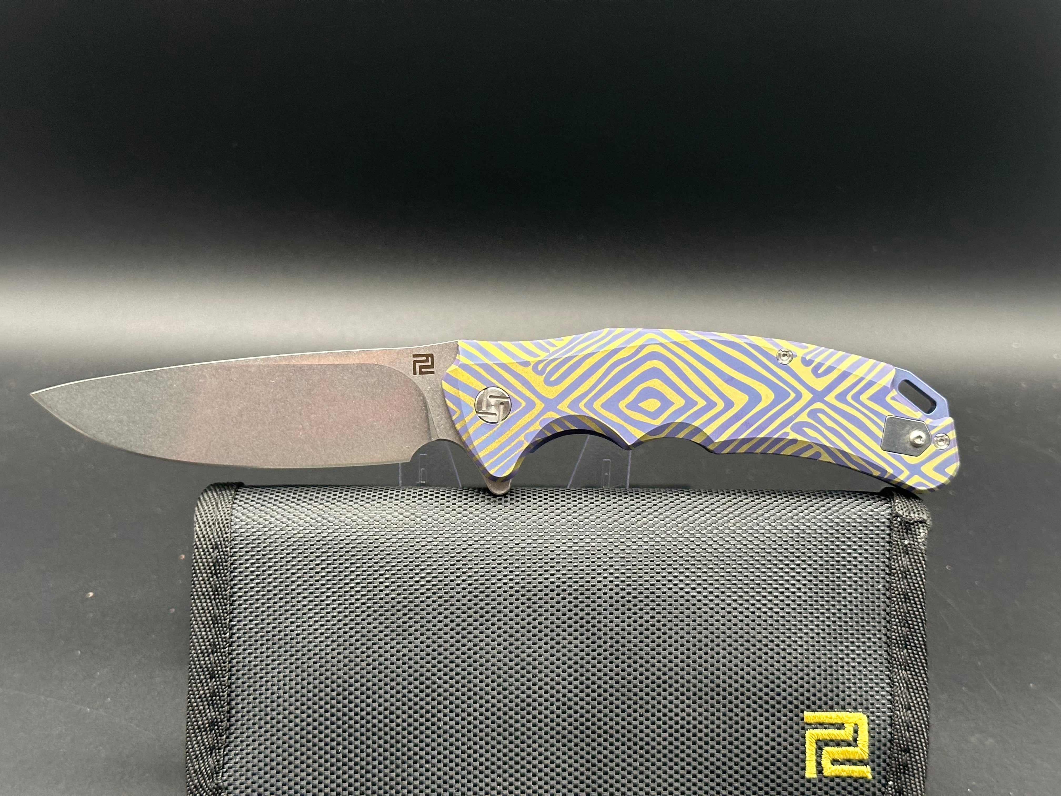 Artisan Cutlery Traditional S35VN Stainless Steel Drop Point Folding Knife with Gold & Blue Anodized Titanium Handle - Perfect for Camping, Hunting, and Everyday Carry (EDC)