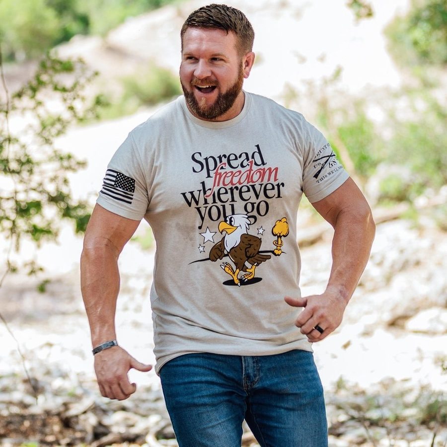 Spreading Freedom Graphic T-Shirt - Patriotic American Flag Design - Comfortable Cotton Tee for Men & Women - Perfect for 4th of July, Veterans Day & Political Events