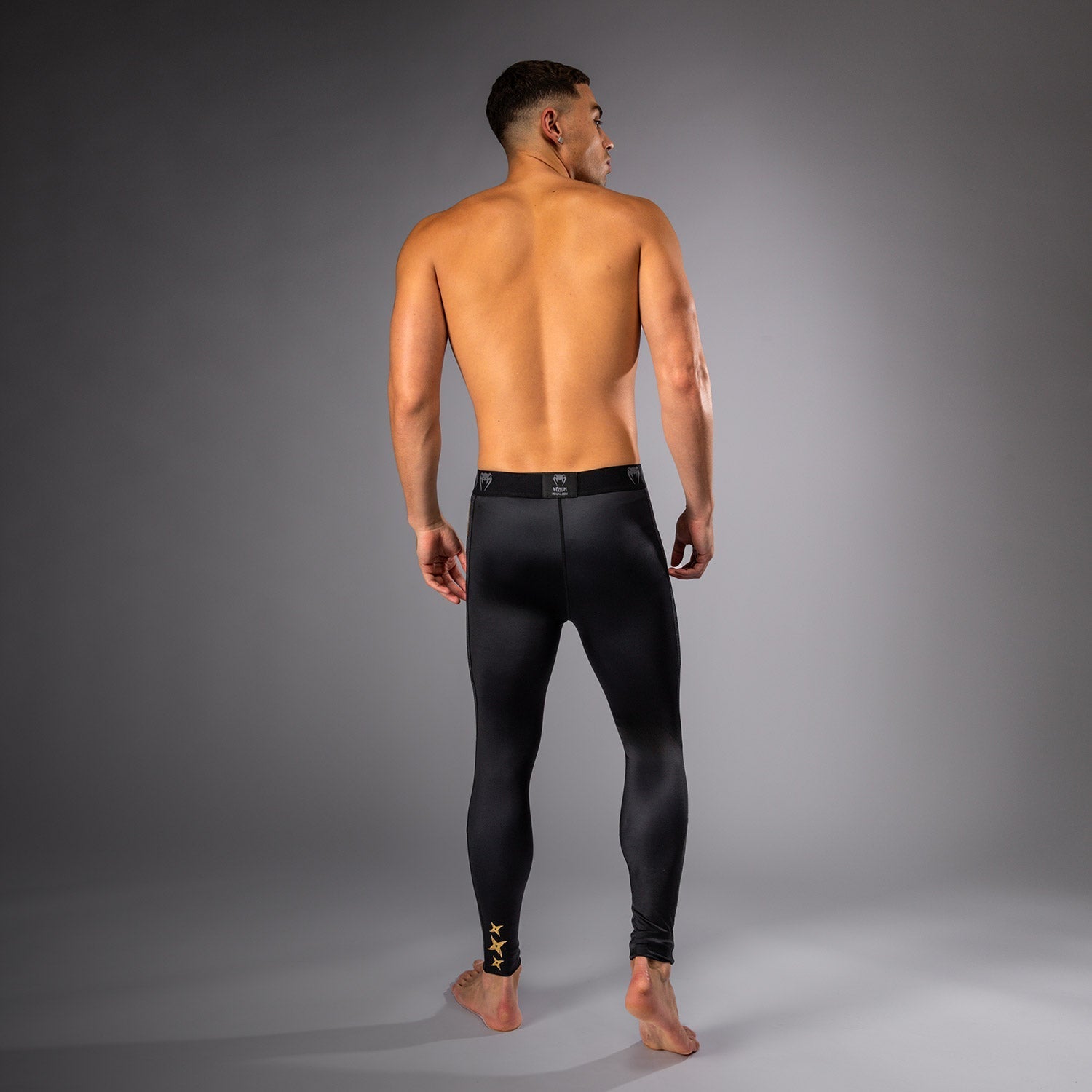 Venum x Assassin's Creed Shadows Spats - Black/Gold MMA Grappling Leg Sleeves for Training & Combat Sports