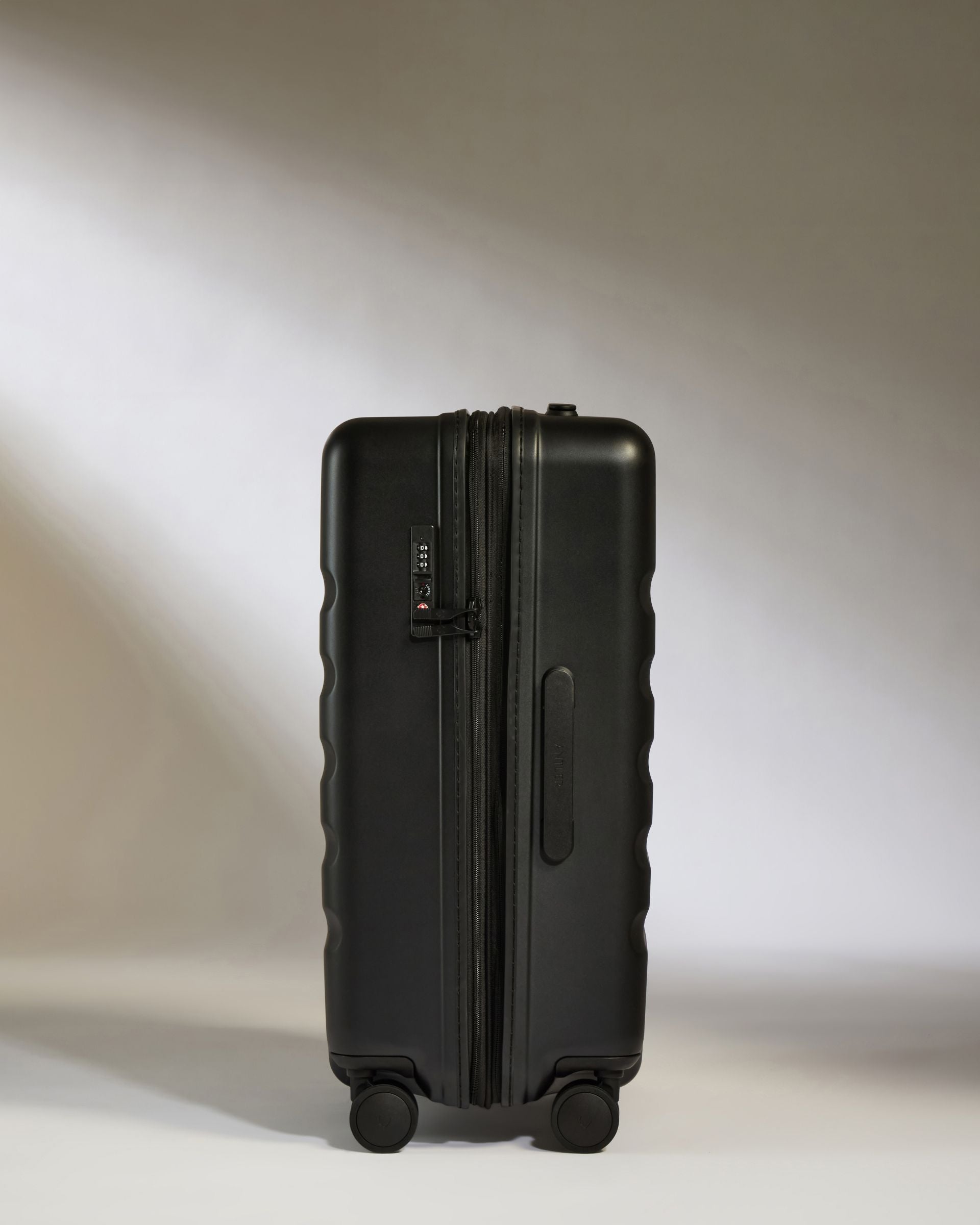 Medium Black Luggage with Icon Stripe - Perfect for Business Travel & Weekend Getaways