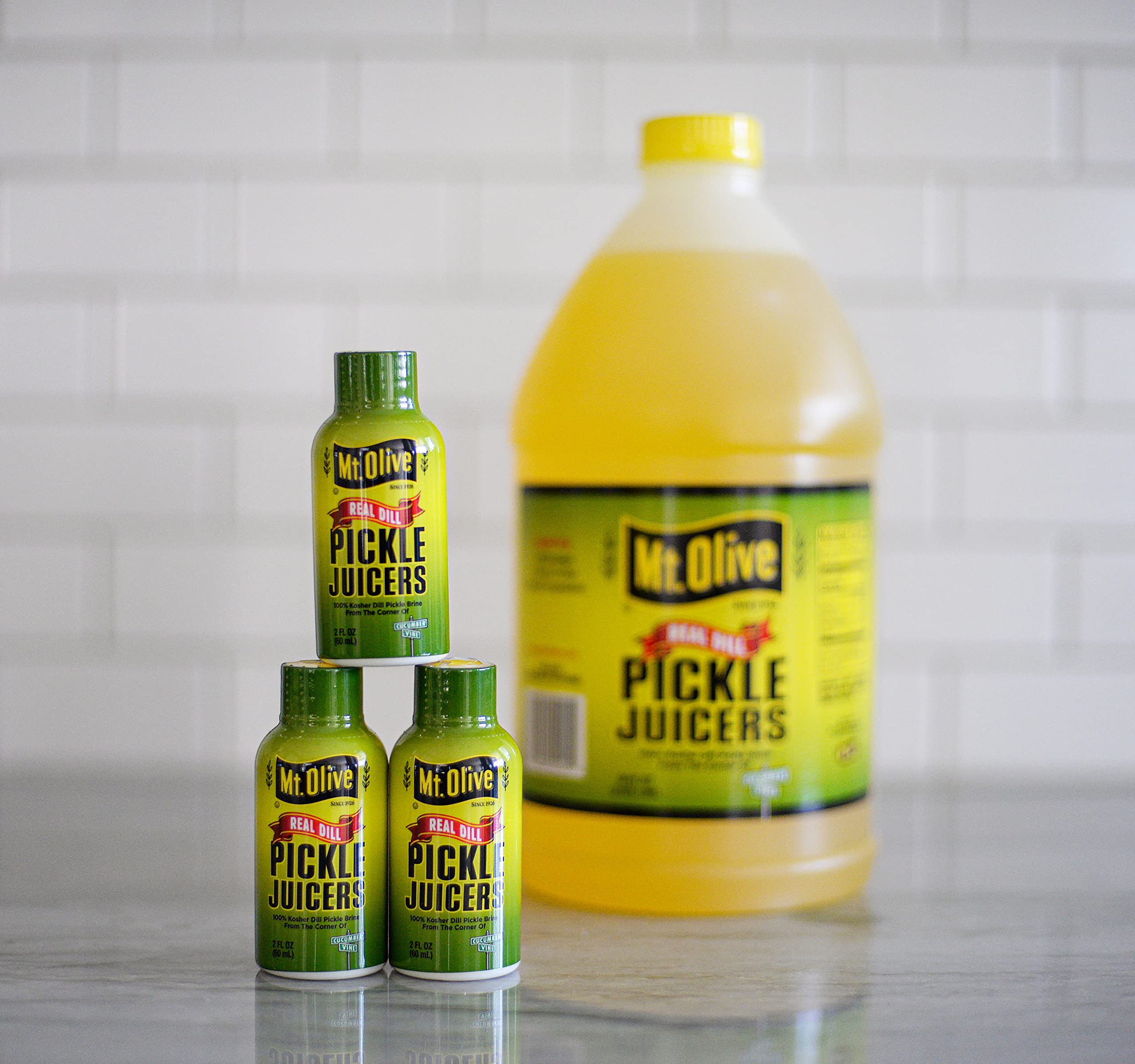 Mt. Olive Pickle Juice 100% Kosher Dill Pickle Brine - 12 Pack of 2 fl oz Bottles | Hydration & Recovery Drink for Athletes, Cocktail Mixer, Cooking Ingredient