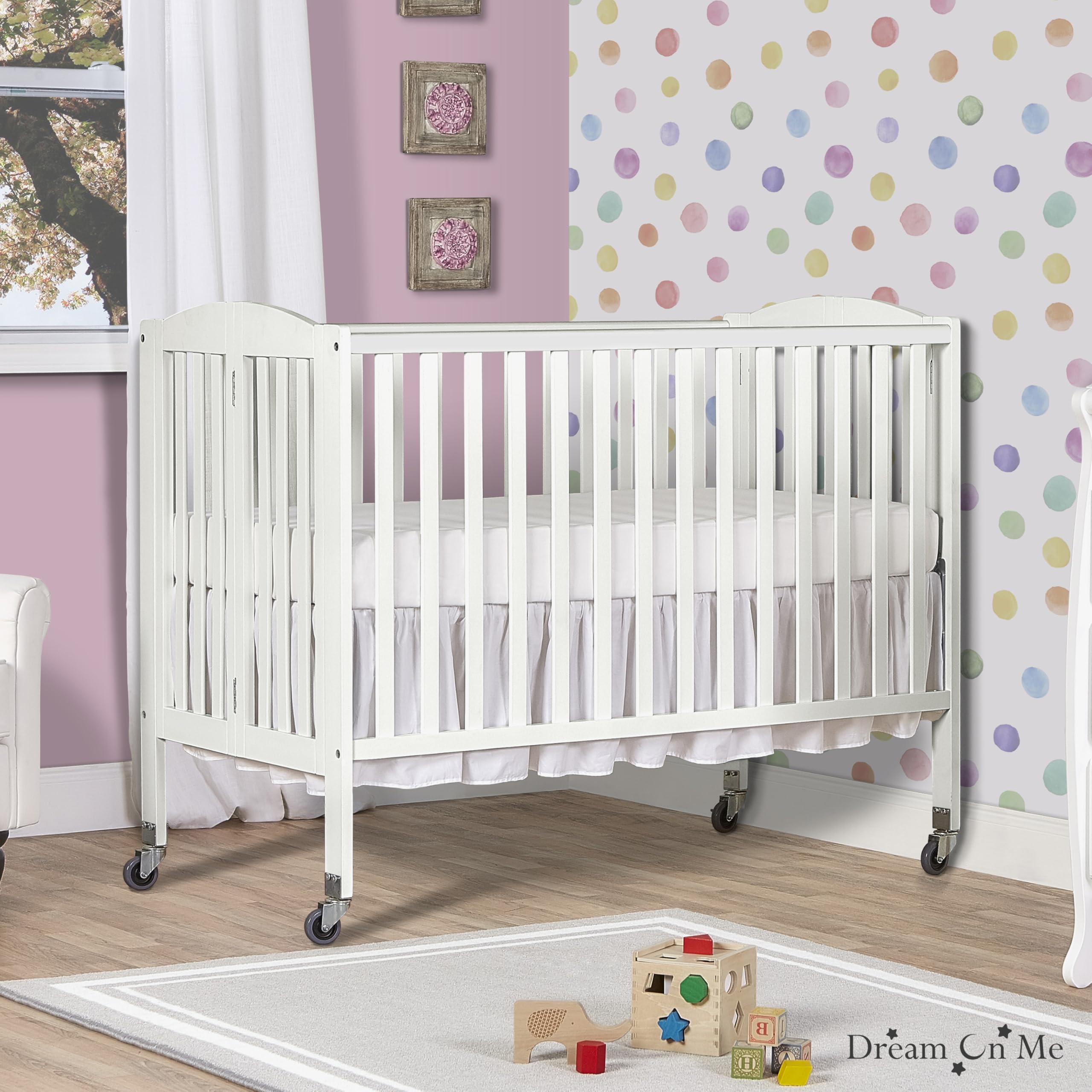 Dream On Me White Folding Full Size Crib with Adjustable Mattress Height & Heavy Duty Locking Wheels - Portable, Space-Saving Nursery Solution for Home & Travel