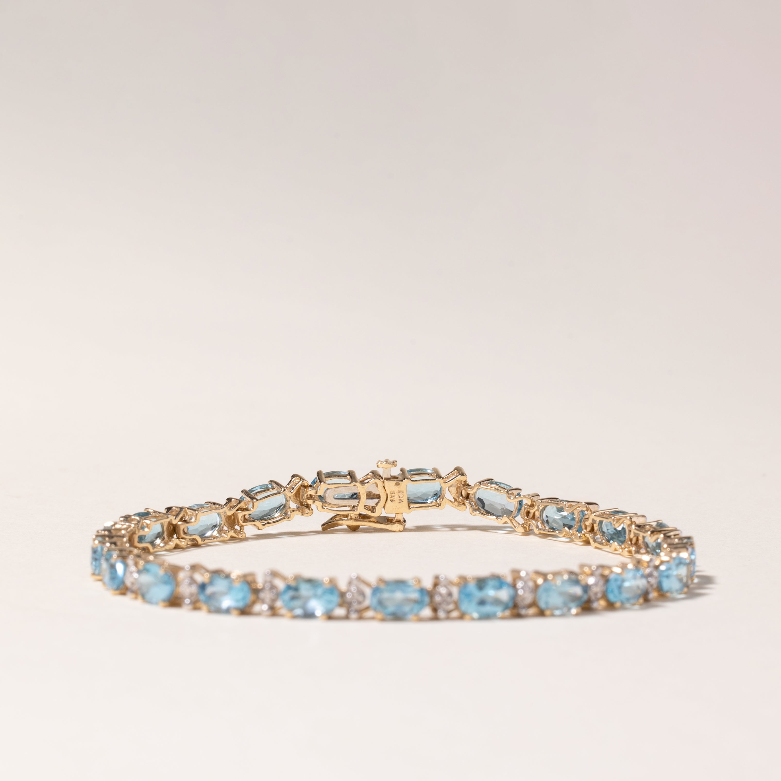 10K Yellow Gold Blue Topaz Tennis Bracelet - 10.29ctw Gemstone Jewelry with 0.01ctw Diamonds - 7.25 Inch Adjustable Length - Perfect for Weddings, Anniversaries & Special Occasions