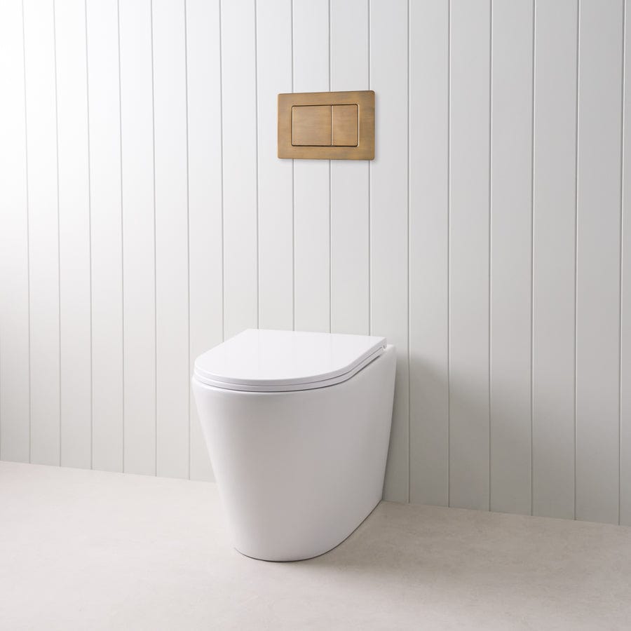 Angled In-Wall Toilet with Rectangle Antique Brass Buttons - Modern Space-Saving Bathroom Solution for Small Homes & Luxury Apartments
