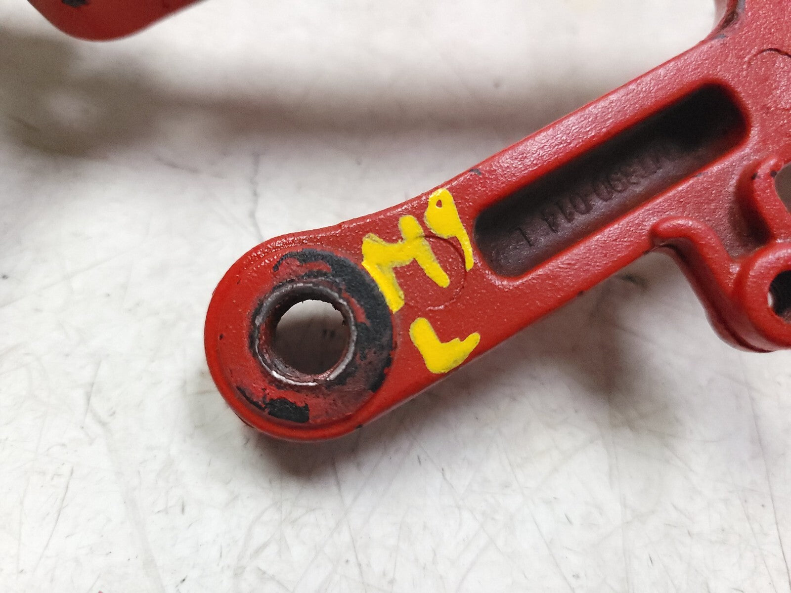 04-05 Honda CBR1000RR Foot Peg Bracket Left Side OEM Replacement Part - Perfect for Motorcycle Repair & Racing Upgrades