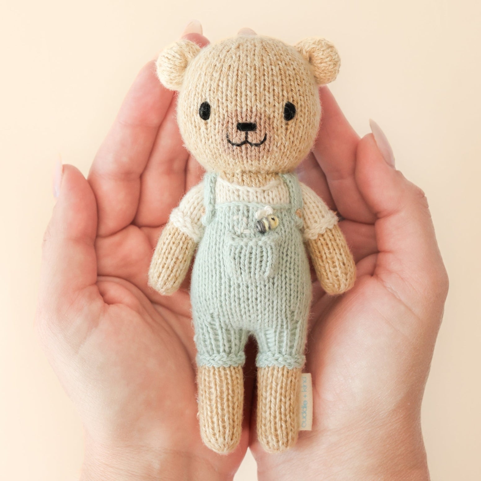 Cuddle + Kind Tiny Charlie the Honey Bear Handmade Knit Doll - Donates 10 Meals to Children in Need | Perfect Baby Shower Gift & Nursery Decor