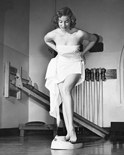 Fitness Motivation Poster - Young Woman Weighing Herself in Gym, 18x24 Inches - Perfect for Home Gym, Workout Room & Fitness Studio Decor