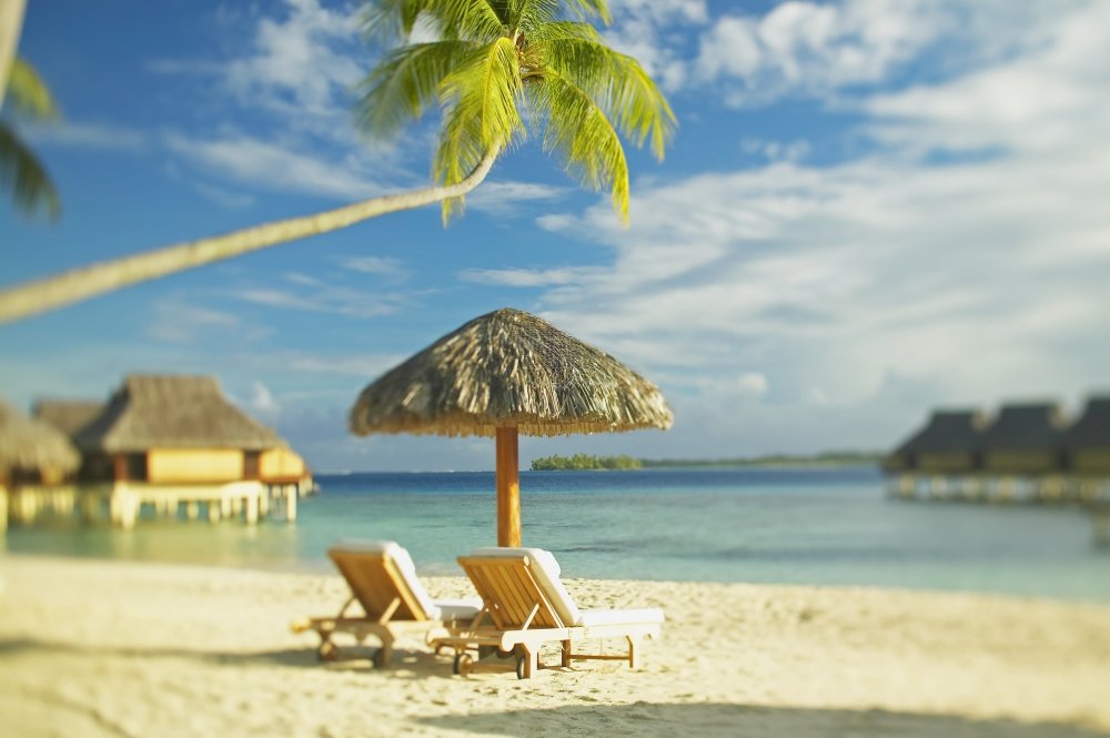 French Polynesia Tahiti Bora Bora Beach Scene Poster - Lounge Chairs & Thatch Umbrella with Ocean View Bungalows - 19x12 Inch Wall Art Print for Home, Office, or Beach House Decor