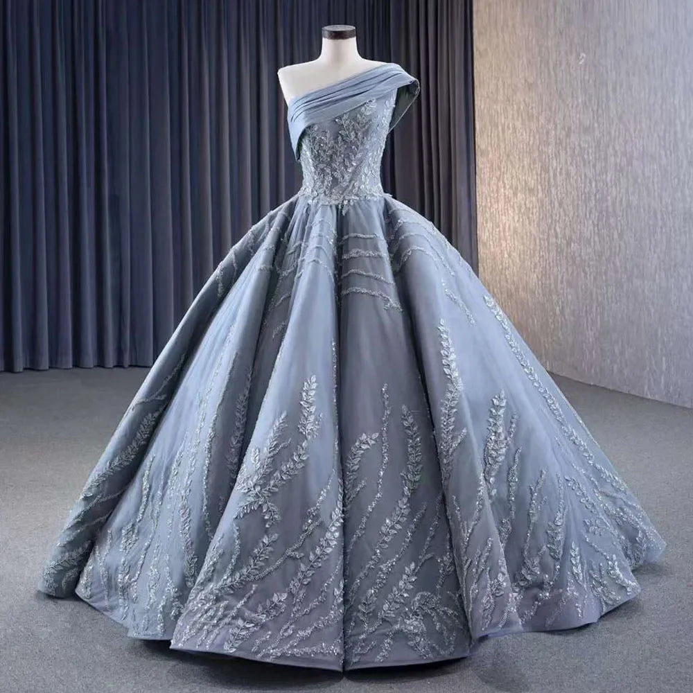 Serene Hill Gray One Shoulder Lace Up Beaded Luxury Ball Gown Wedding Dress 2025 | Custom Made Bridal Gown HM231074 | Perfect for Formal Weddings, Red Carpet Events & Evening Galas