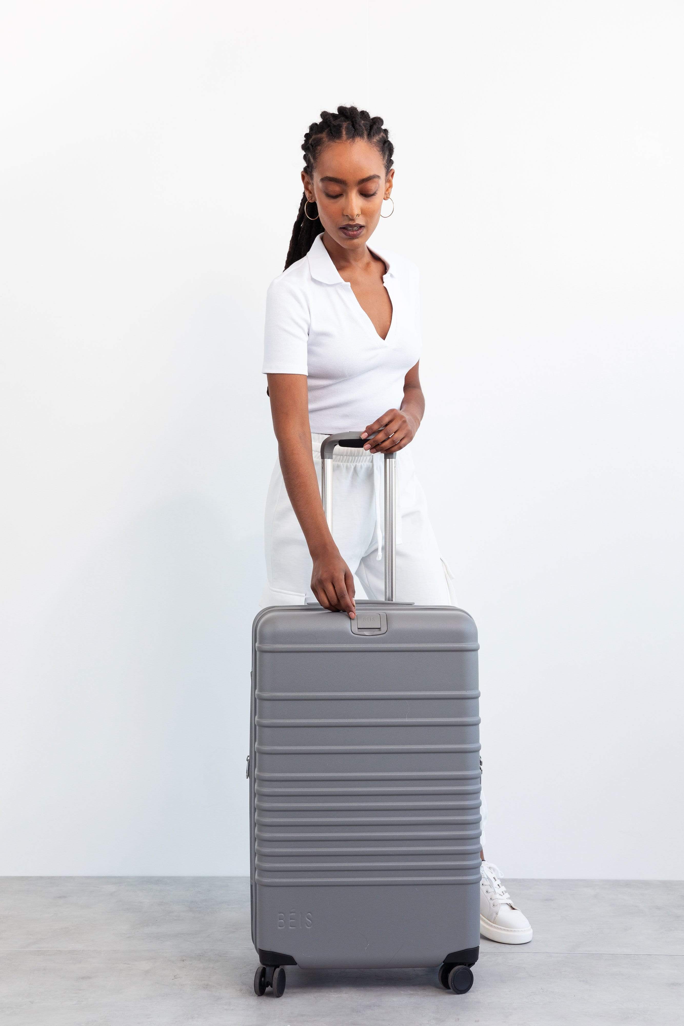 Medium Grey Check-In Roller Luggage - Perfect for Air Travel, Business Trips & Weekend Getaways