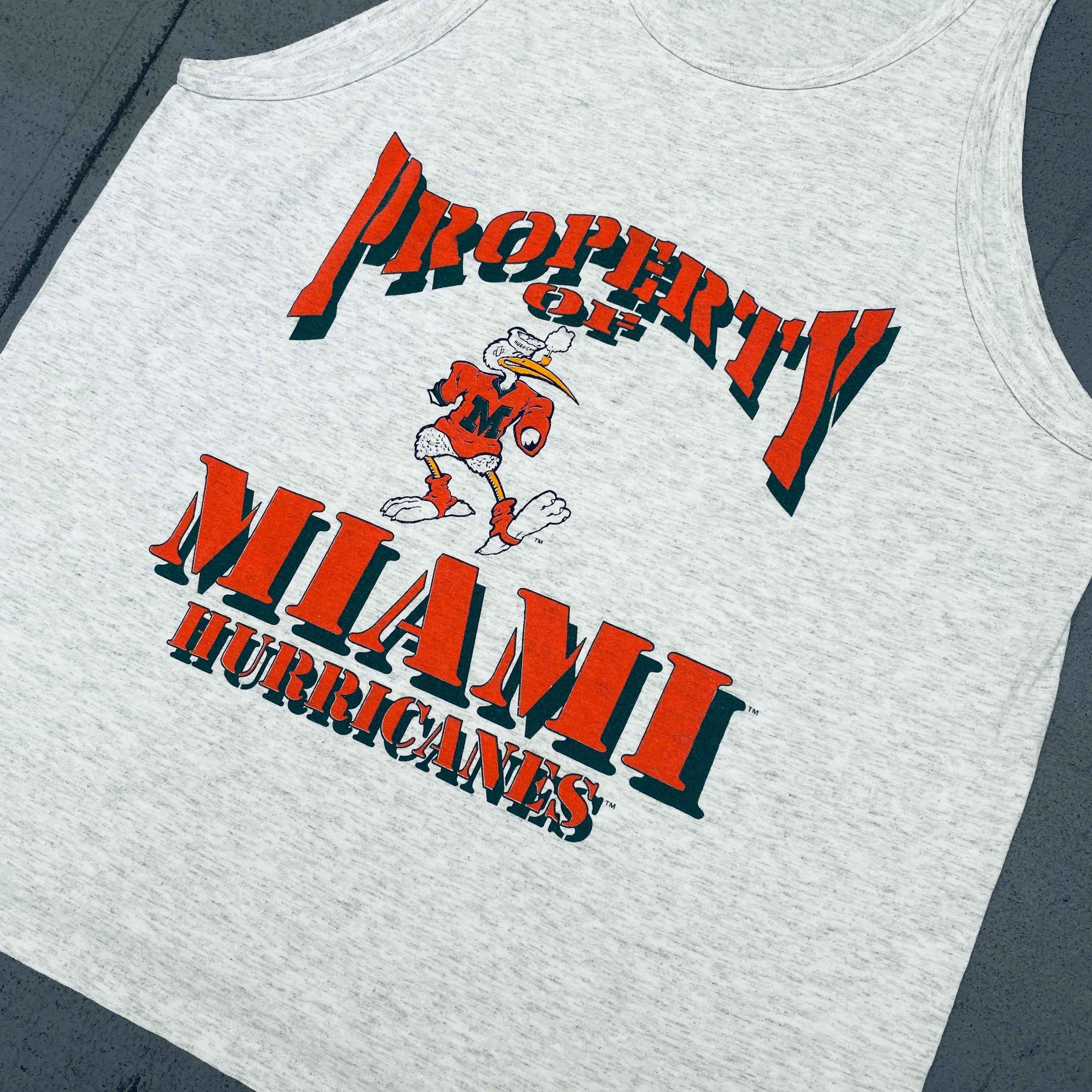 Vintage 1990s Miami Hurricanes Muscle Tee - Official NCAA Licensed Cotton T-Shirt (Large/XL) - Perfect for Game Day, Sports Events & Retro Fashion