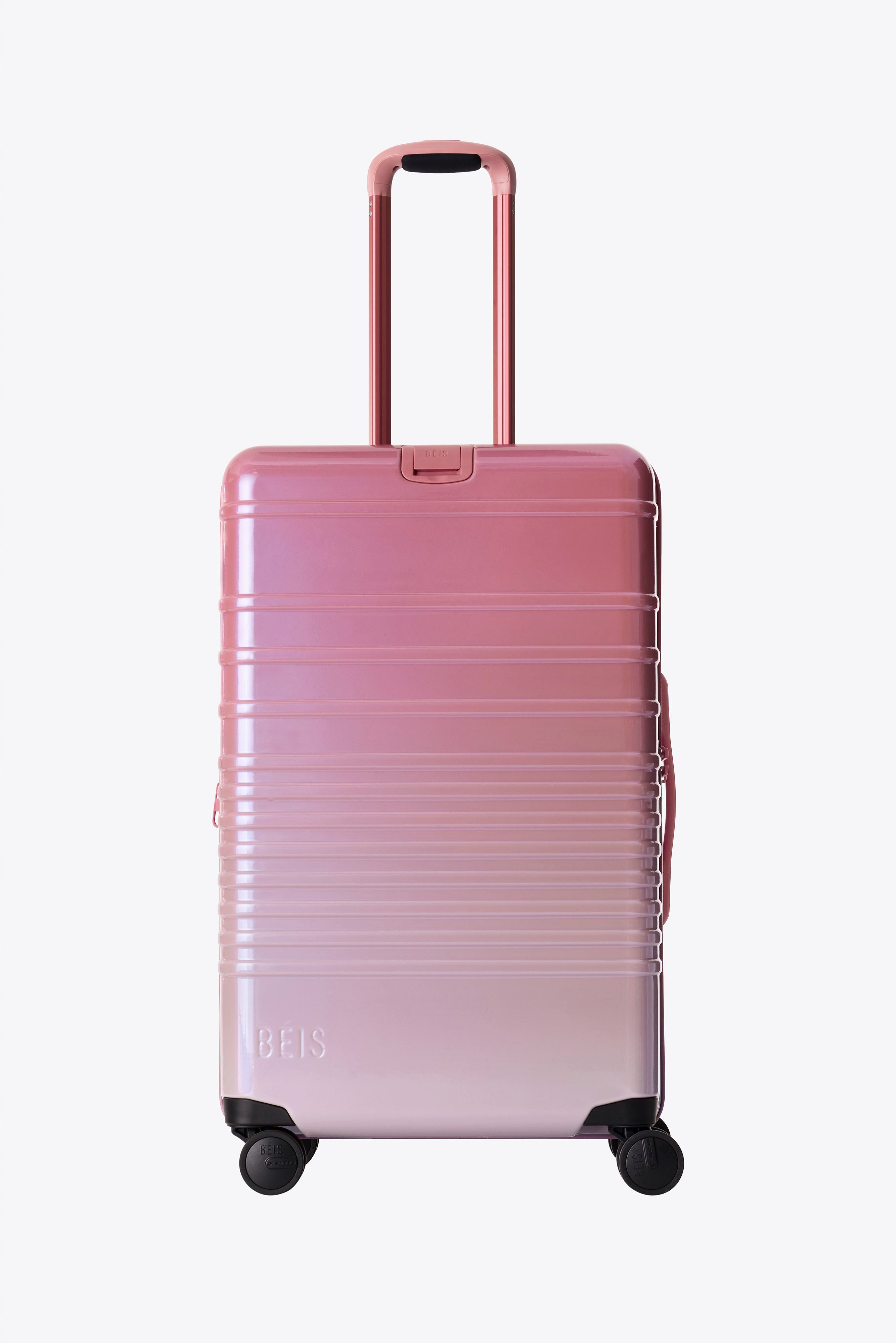 The Medium Check In Roller Luggage in Wicked Pink - Perfect for Business Travel & Weekend Getaways