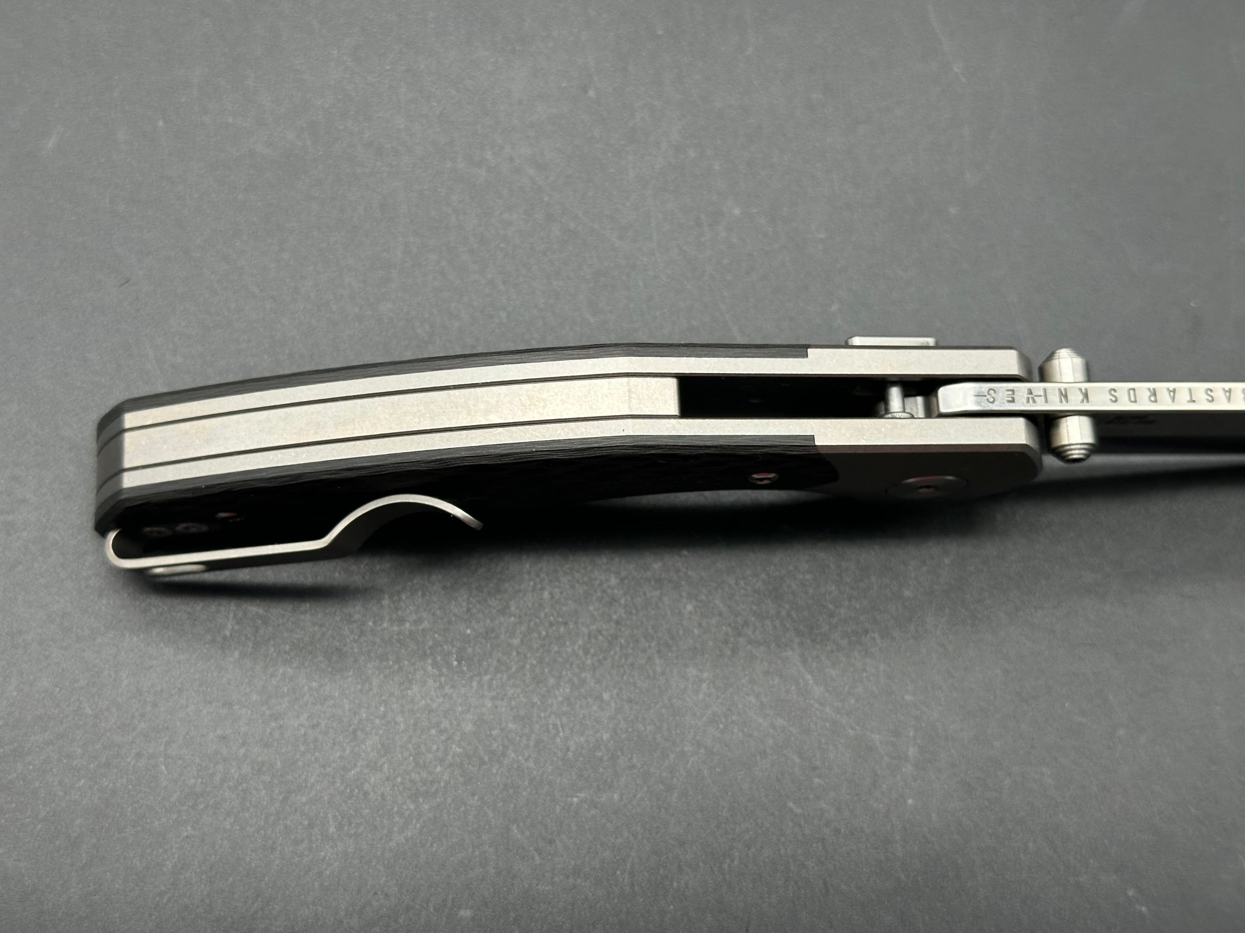 BASTARD KNIVES UTOPIA Button Lock Pocket Knife - M390 Blade, Carbon Fiber & Titanium Handle - EDC Folding Knife for Outdoor, Camping & Everyday Carry