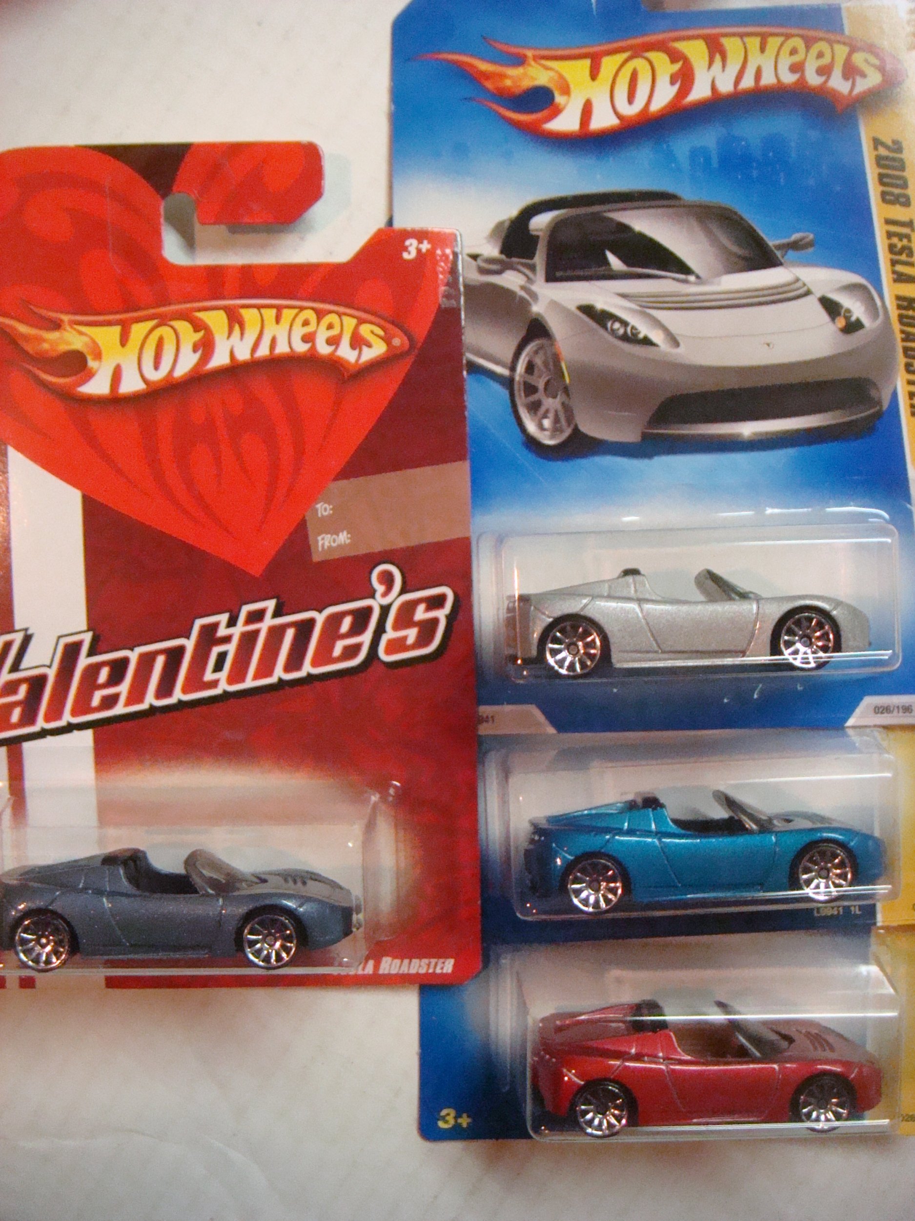Hot Wheels Tesla Roadster Diecast Car Set - 1/64 Scale Collector's Edition (Metallic Blue, Silver, Red) - Valentine's Gift Idea for Car Enthusiasts - Perfect for Display, Gifting, and Toy Car Racing Collections