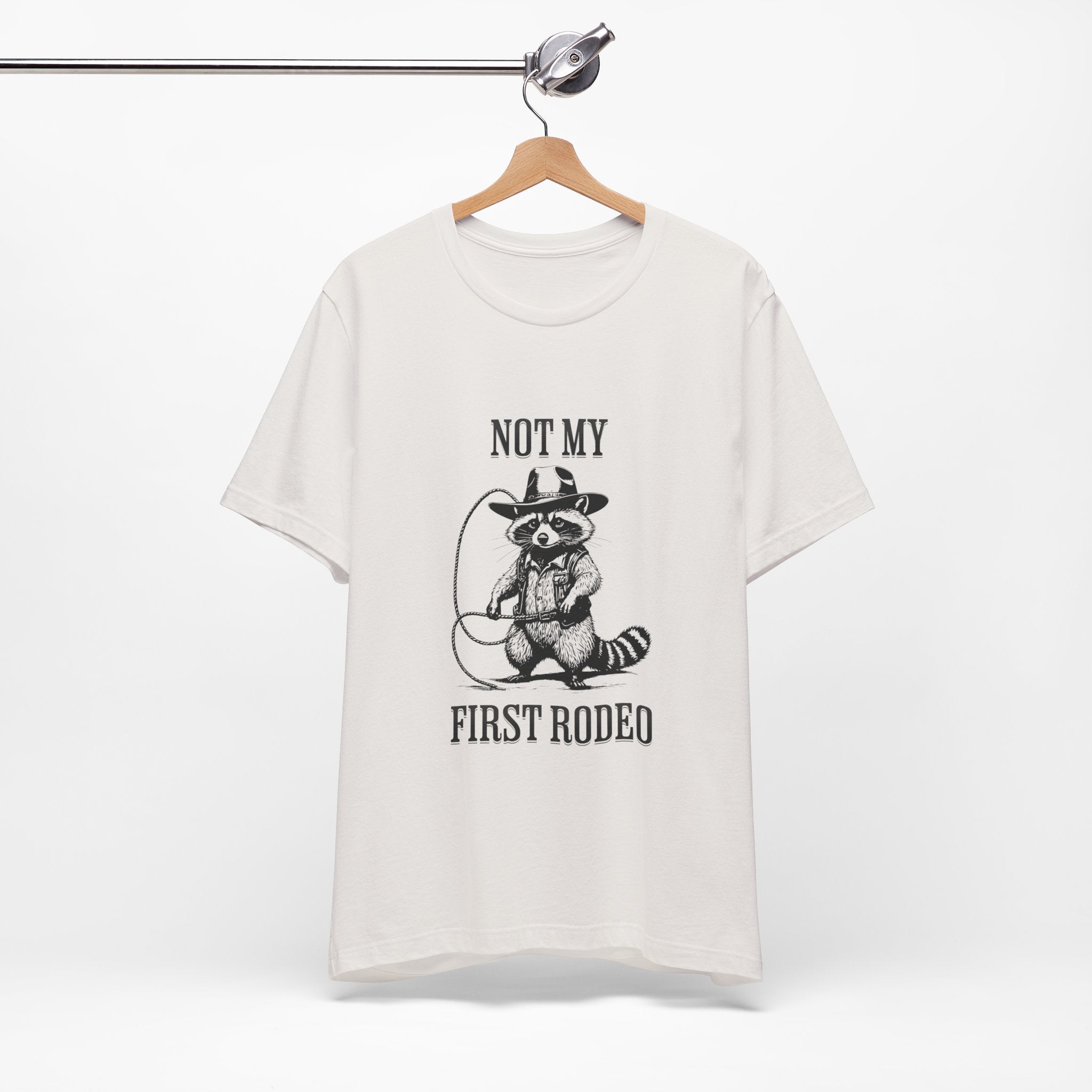 Funny Western Graphic Cotton Tee - Not My First Rodeo Cowboy Raccoon Shirt | Cute Quirky Country Style T-Shirt for Rodeo Fans & Animal Lovers | Perfect for Rodeo Events, Country Concerts & Casual Wear