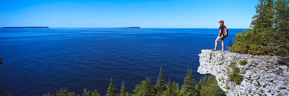 Peel & Stick Wall Murals - Hiker on Cliff Georgian Bay Ontario (84x28 Inch) Removable Wallpaper for Bedroom, Living Room & Office Decor - Easy DIY Home Decoration