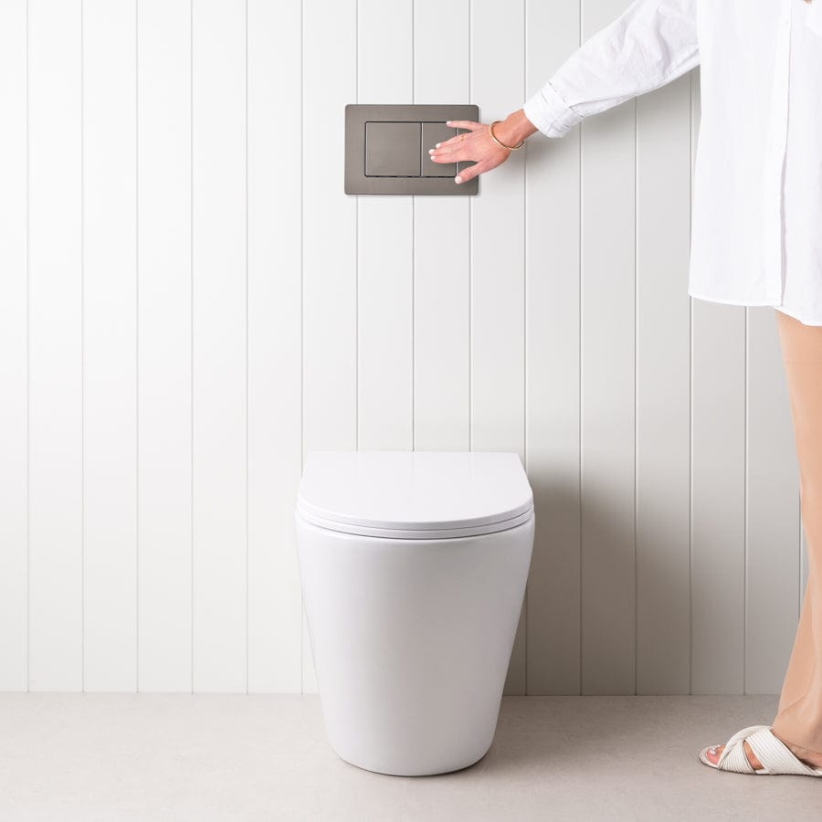 Angled In-Wall Toilet with Rectangle Gunmetal Buttons - Modern Space-Saving Bathroom Solution for Small Spaces and Contemporary Homes
