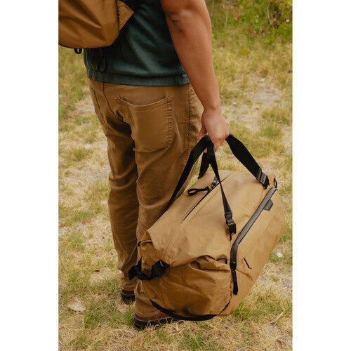 Peak Design Travel Duffel 35L Carry-On Duffel Bag - Waterproof & Durable Coyote Brown Backpack for Adventure Travel, Camping & Outdoor Activities