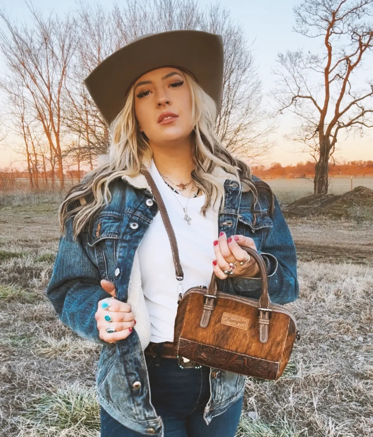 Wrangler Genuine Hair-On Cowhide Barrel Bag - Western Style Leather Crossbody Purse for Women | Perfect for Rodeo, Country Music Festivals & Everyday Use