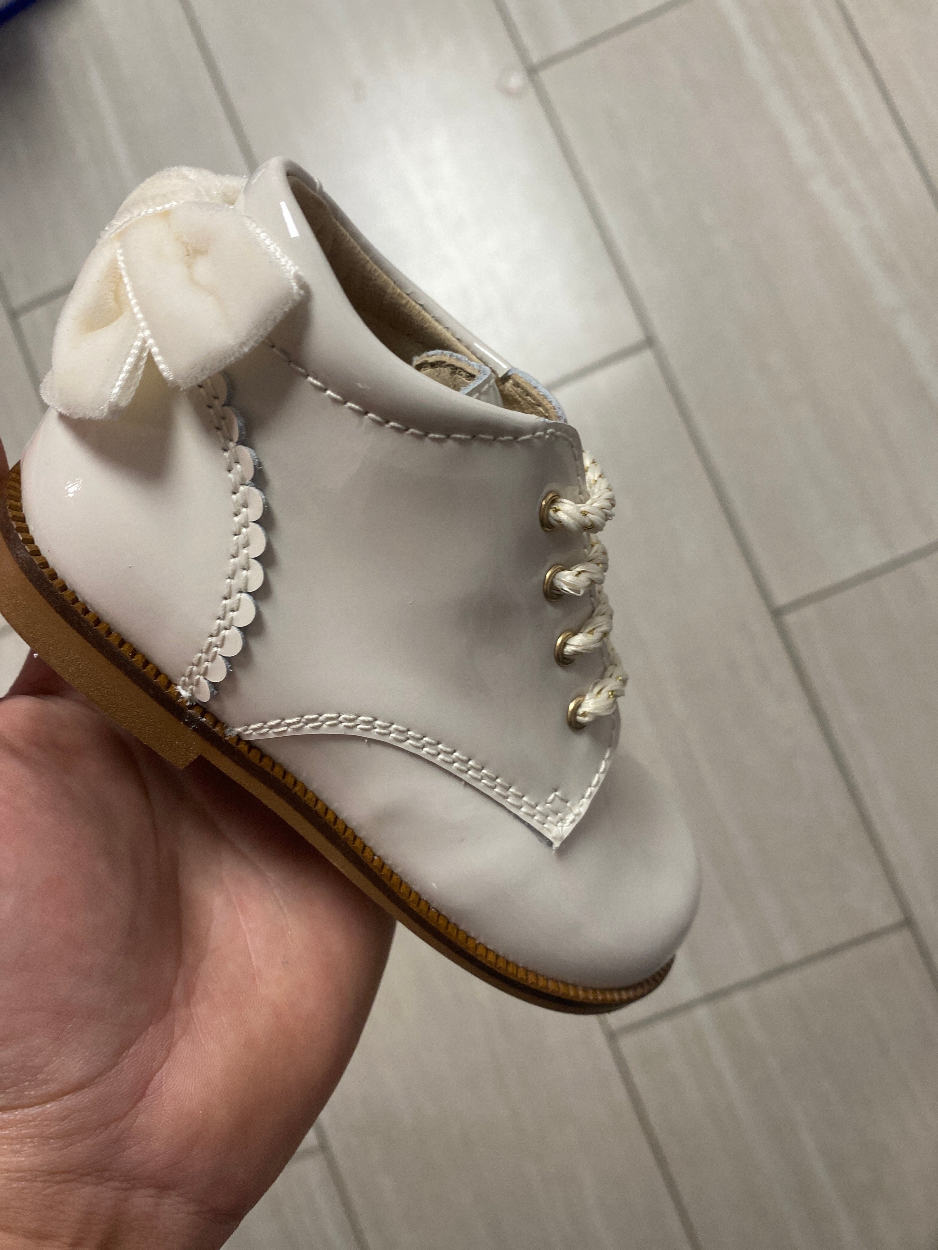 Beberlis Off White Patent Leather Bow Baby Booties - Soft & Stylish First Walkers for Newborns & Infants - Perfect for Photo Shoots, Special Occasions & Everyday Wear