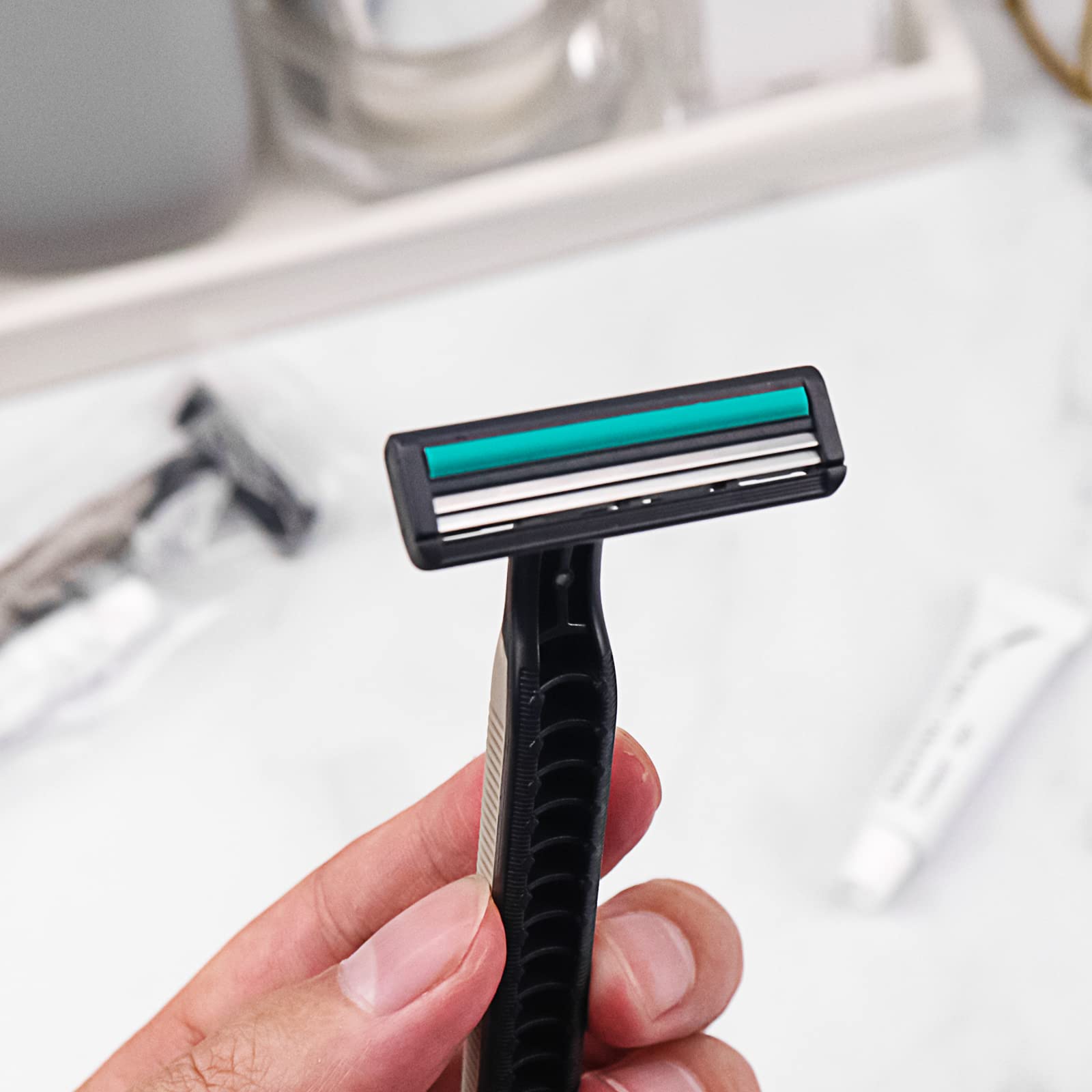 Bulk Disposable Razors with Knife Cap - 100 Pack Individually Wrapped Grey Razors for Shaving | Includes Shaving Cream | Perfect for Hotels, Homeless Shelters, Nursing Homes & Charity Organizations | Travel & Personal Hygiene Essential