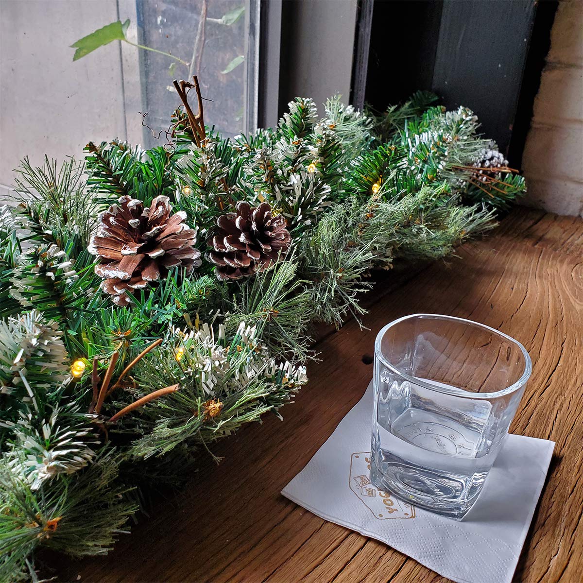 9 FT Prelit Christmas Garland with Pine Cones - Artificial Snowy Pine Garland with 50 LED Warm White Battery Operated Lights & Timer - Indoor Outdoor Holiday Decor for Fireplace, Mantel, Staircase & Doorway