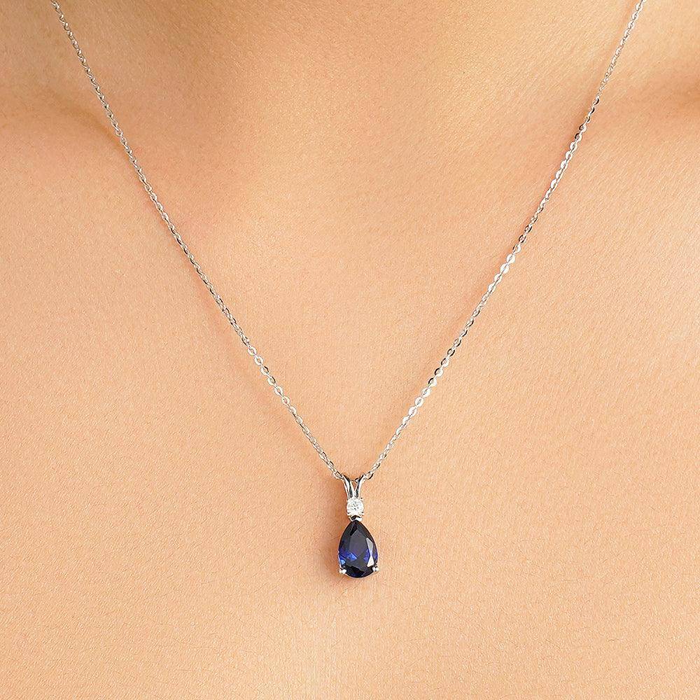1.7 Carat Pear Cut Blue Sapphire Solitaire Pendant with White Sapphire Accents - Elegant Jewelry for Weddings, Anniversaries & Special Occasions