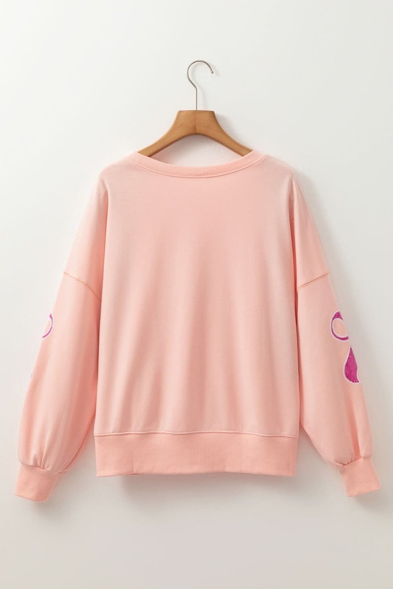 Stylish Apricot Pink Sequined Bowknot Drop Shoulder Oversized Sweatshirt for Women | Trendy Loose Fit Pullover | Perfect for Casual Outings, Parties & Date Nights