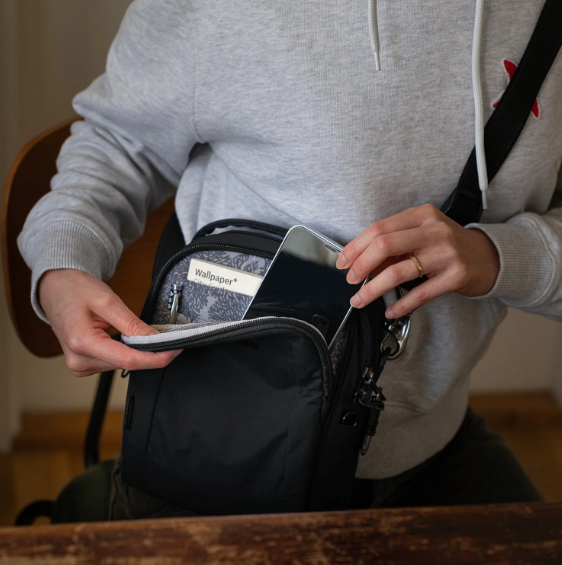 Pacsafe Metrosafe LS100 Anti-Theft Crossbody Bag for Women & Men - Secure Travel & Commuting - RFID Blocking, Slash-Resistant Straps, Lightweight Design