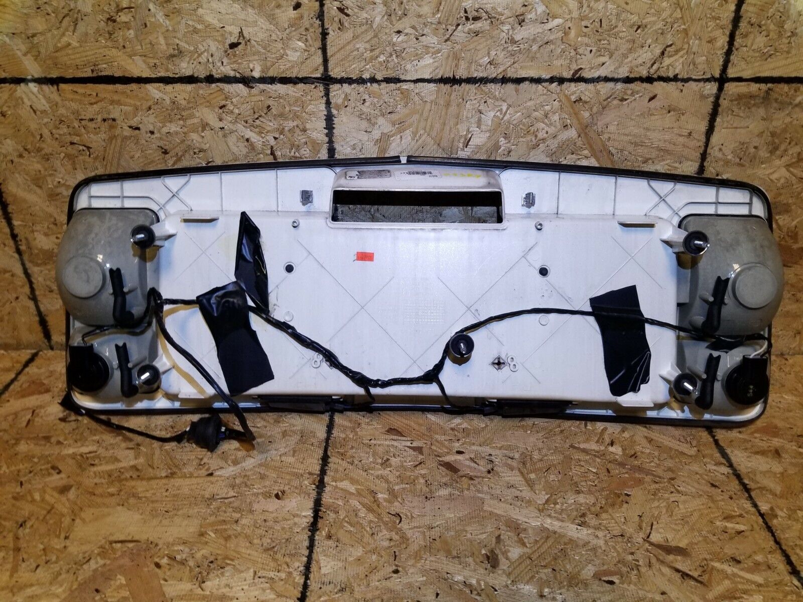 2005-2009 Cadillac SRX OEM Tailgate License Plate Holder with Backup Light - Perfect for Rear Bumper Replacement & Nighttime Visibility
