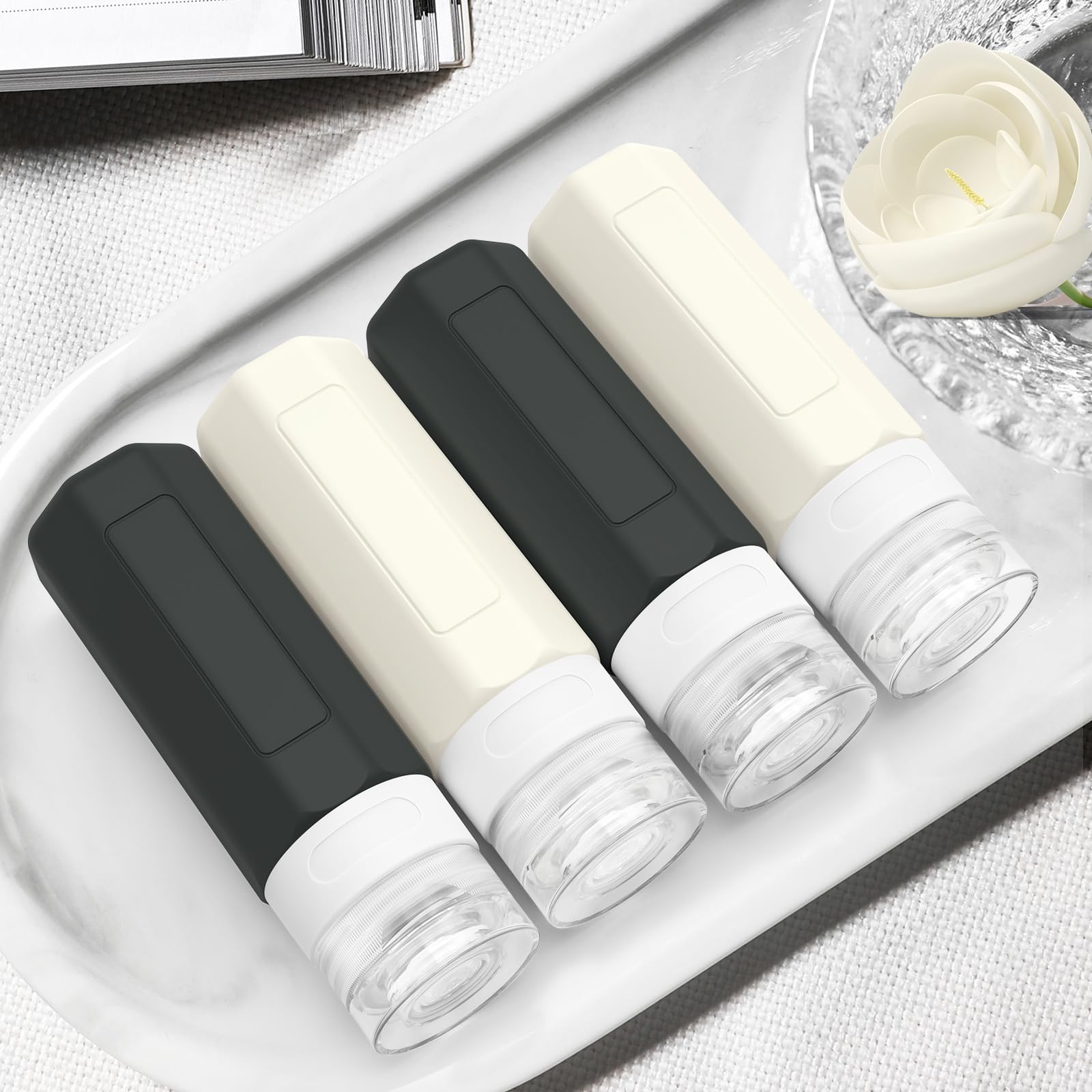 Redfly 3oz TSA Approved Travel Bottles for Toiletries - BPA Free Leak Proof Silicone Containers for Shampoo & Conditioner (Black & White) - Perfect for Air Travel, Gym & Vacation Essentials