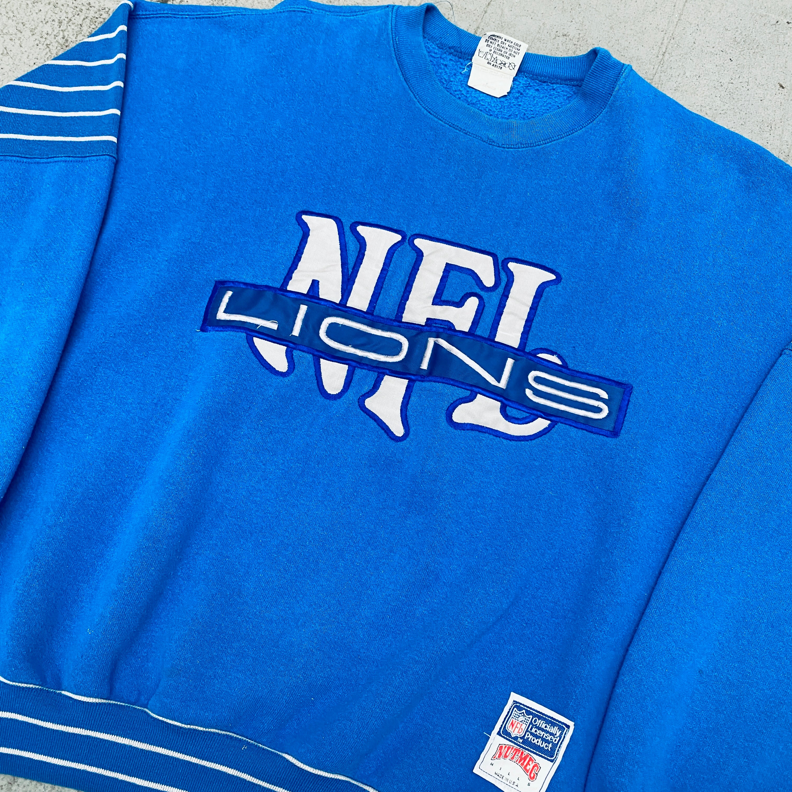 Detroit Lions 1990s Nutmeg Mills Embroidered Spellout Sweatshirt - Men's Vintage NFL Football Fan Apparel for Game Day & Casual Wear