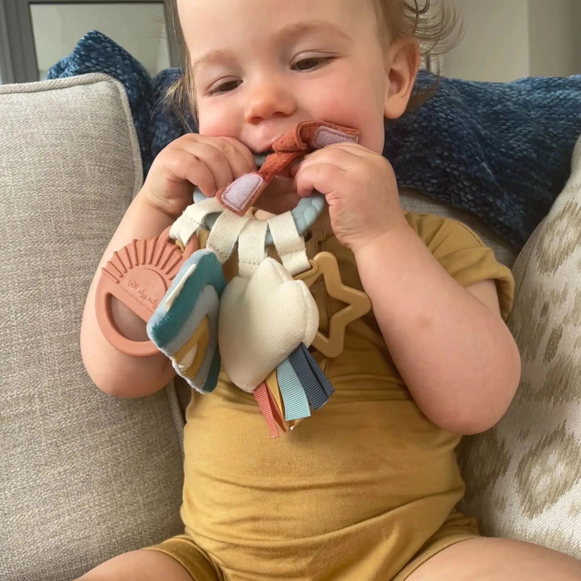Itzy Ritzy Bitzy Busy Ring Teething Activity Toy - Soft Silicone Teether for Babies, Sensory & Chewing Toy for Infants, Perfect for Soothing Sore Gums & Developmental Play | Cloud Design