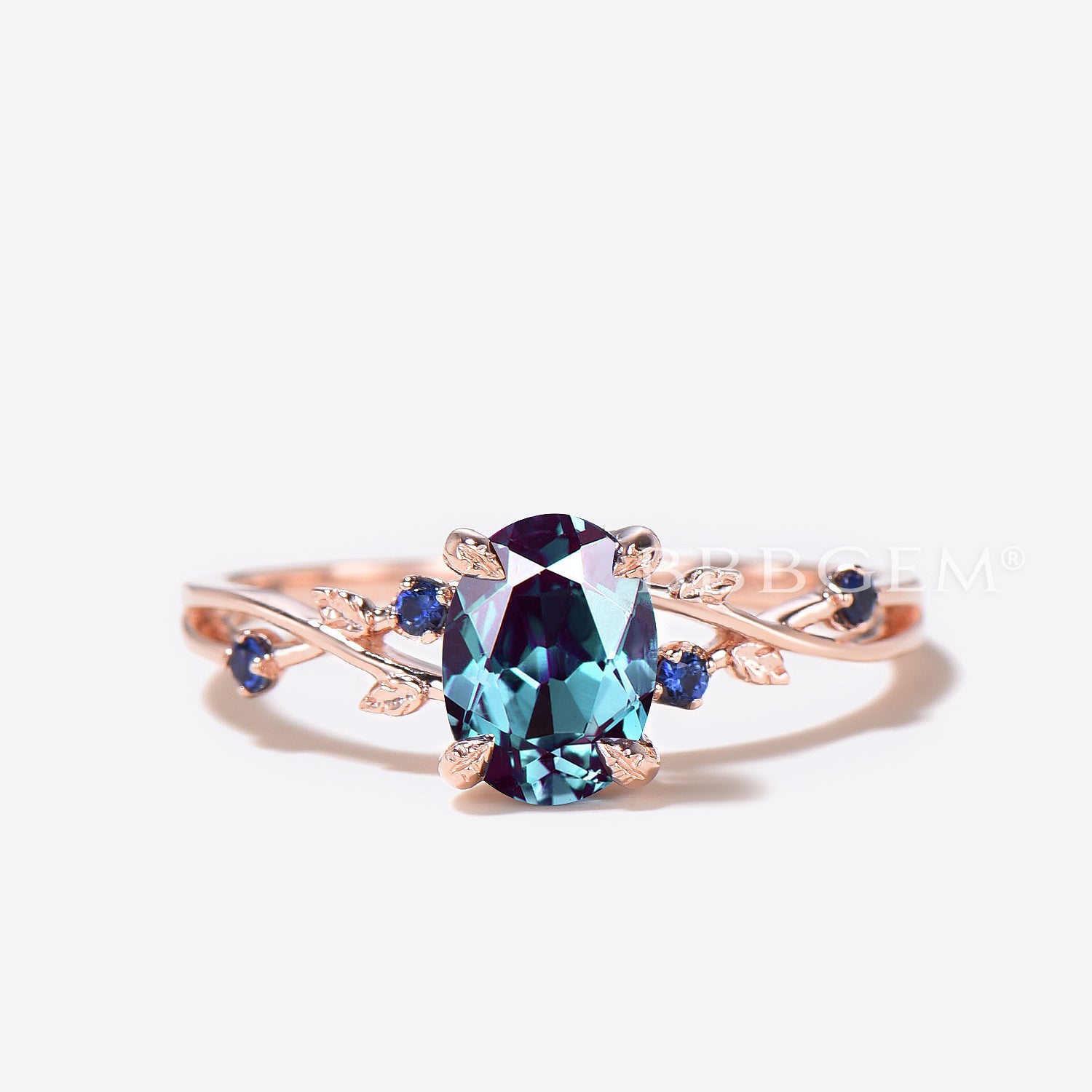 Twisted Vine Oval Color Changing Alexandrite Ring with Leaf Design & Blue Sapphire Accents – Perfect for Weddings, Anniversaries, and Special Occasions