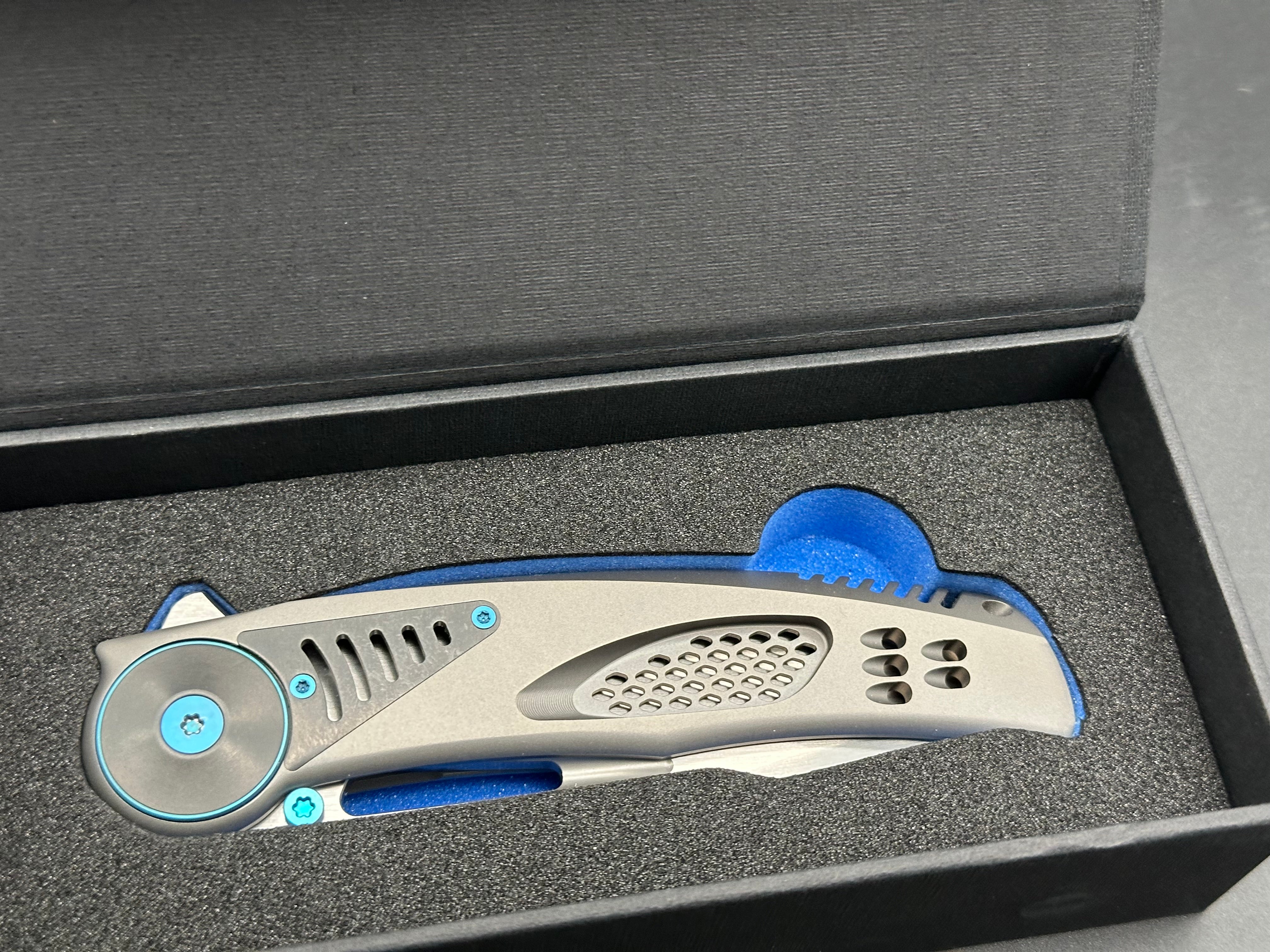 REATE GTR Titanium Folding Knife with Zirconium Inlay & Blue Hardware - M390 Steel Blade - EDC Pocket Knife for Outdoor Camping, Hiking and Everyday Carry