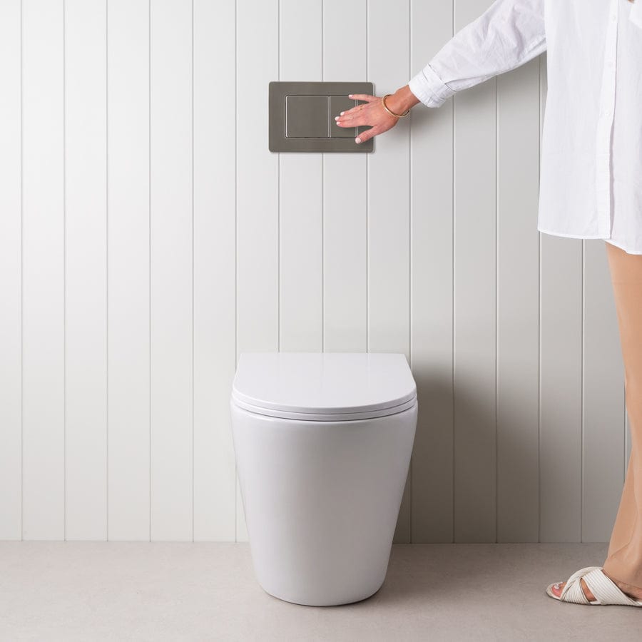 Stylish Curved In-Wall Toilet with Round Gunmetal Buttons - Modern Space-Saving Bathroom Solution for Small Homes and Luxury Apartments