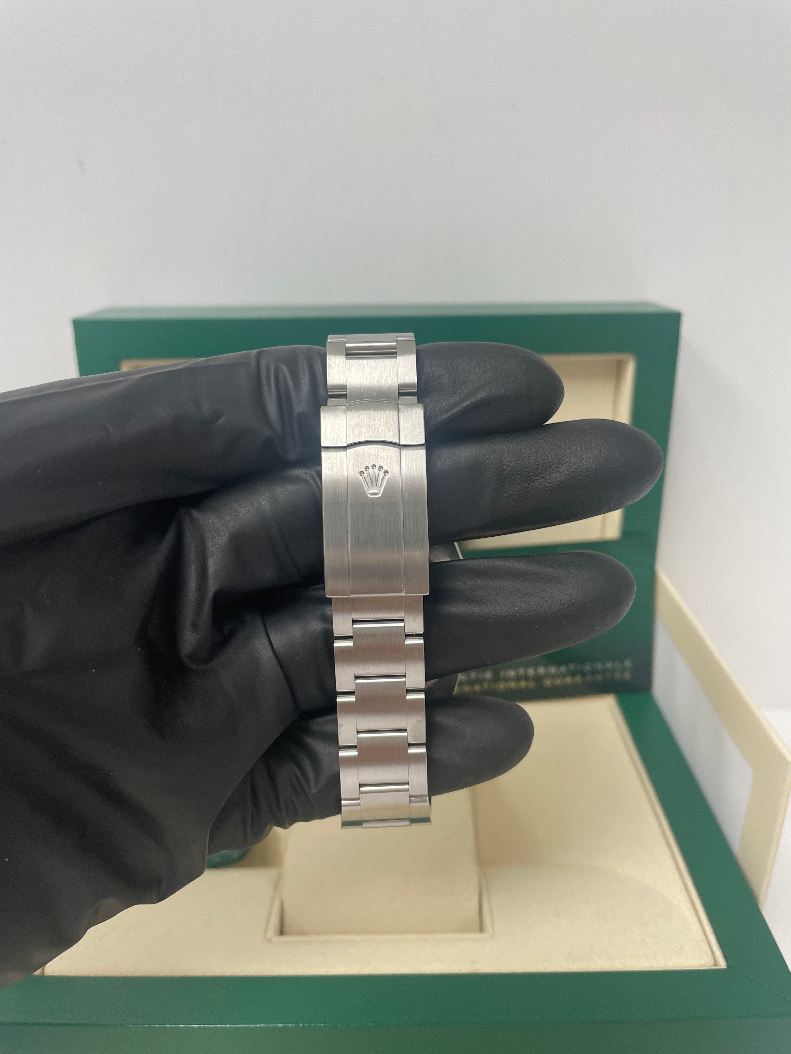 Rolex Oyster Perpetual 41mm Men's Watch - Stainless Steel Case, Turquoise Blue Dial, Oyster Bracelet (Ref# 124300) | Luxury Dress Watch for Business & Formal Occasions