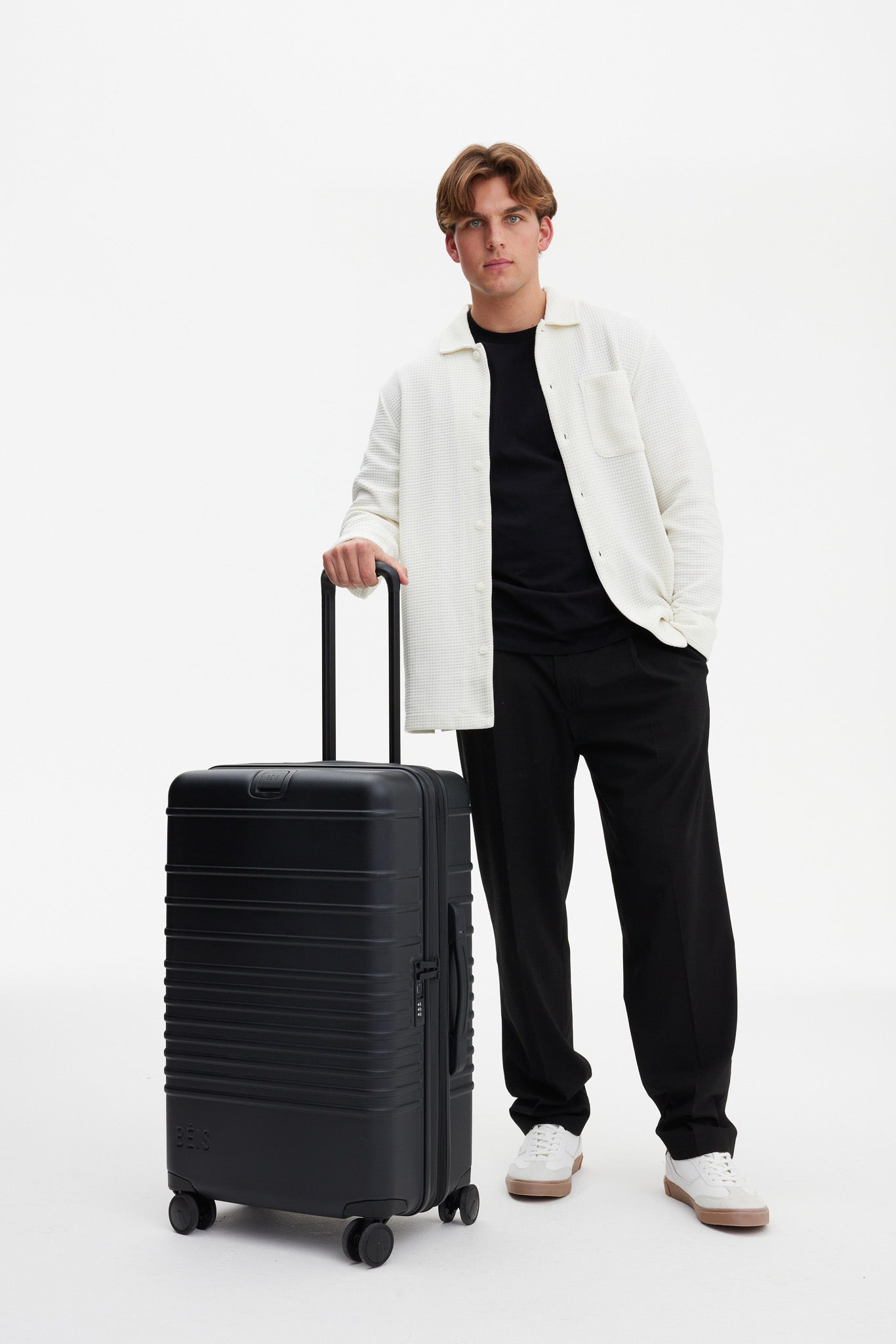 All Black Medium Check-In Roller Luggage - Perfect for Business Travel & Weekend Getaways