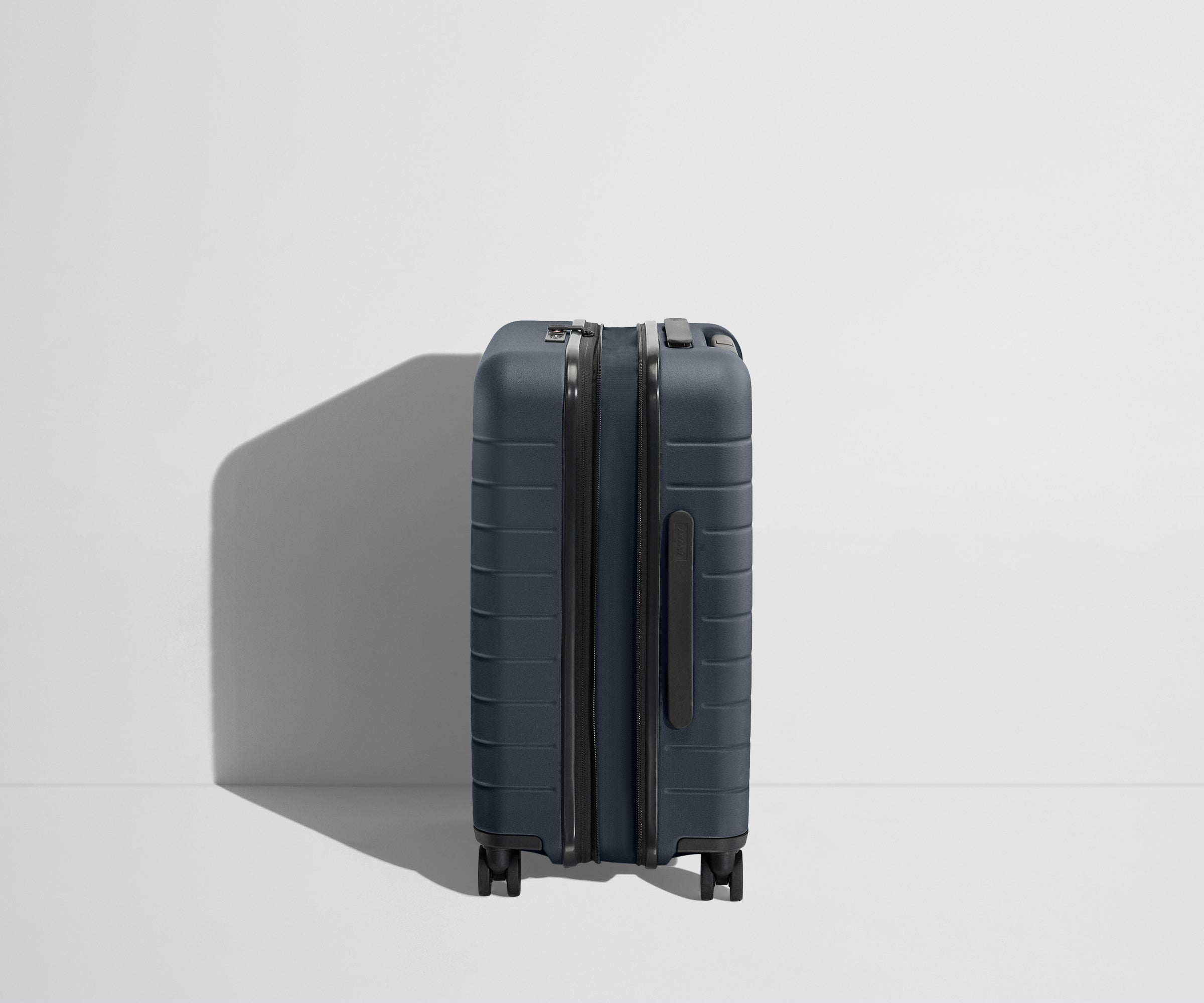 The Carry On Flex in Navy Blue - Lightweight Expandable Luggage for Travel - Perfect for Airplane, Business Trips & Weekend Getaways