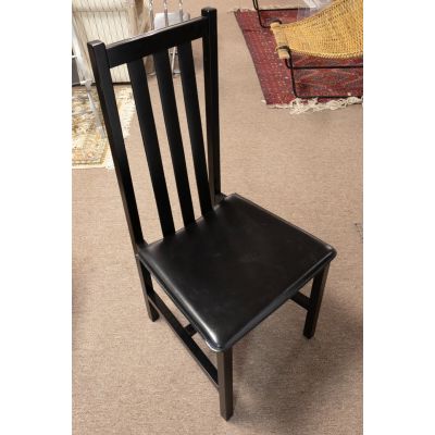 A Tale of Elegance and Comfort: The Modern Black Wooden Dining Chairs