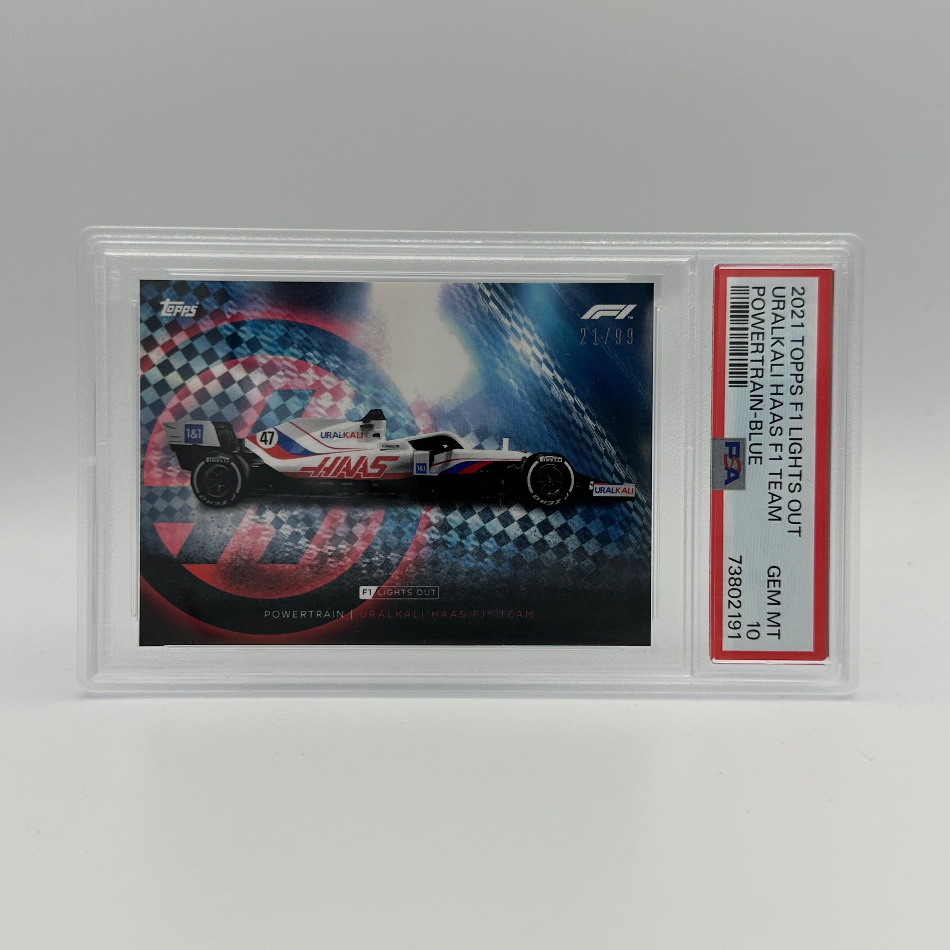 PSA 10 21/99 Uralkali Haas F1 Team Power Train Blue - Collectible F1 Racing Memorabilia for Display & Investment    Perfect for F1 fans, collectors, and motorsport enthusiasts to showcase in home offices, man caves, or racing-themed rooms. Also a valuable investment piece for trading card portfolios.