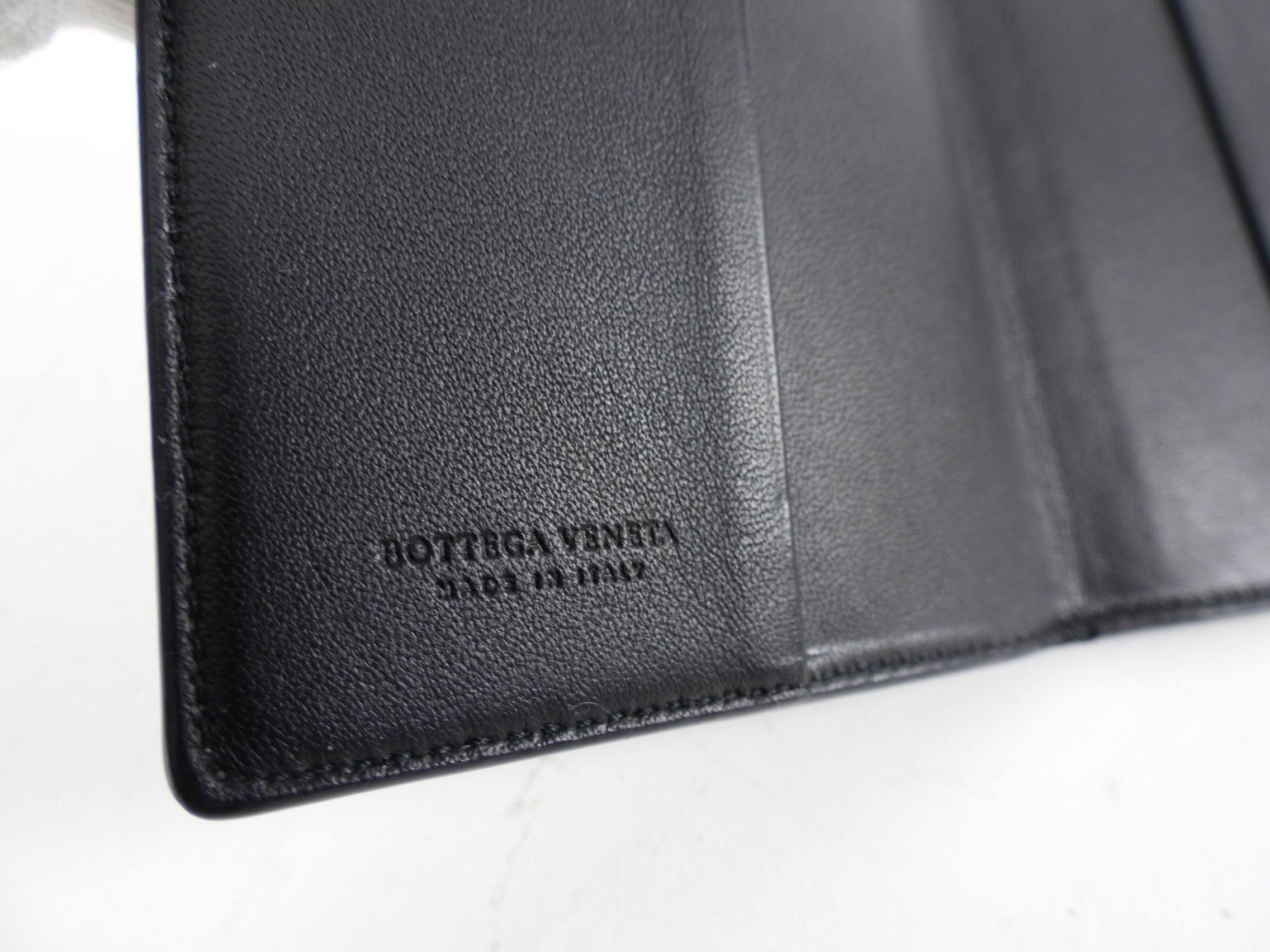 Bottega Veneta Black Intrecciato Leather Passport Wallet - Luxury Travel Accessory for Men & Women, Perfect for Airports and International Trips