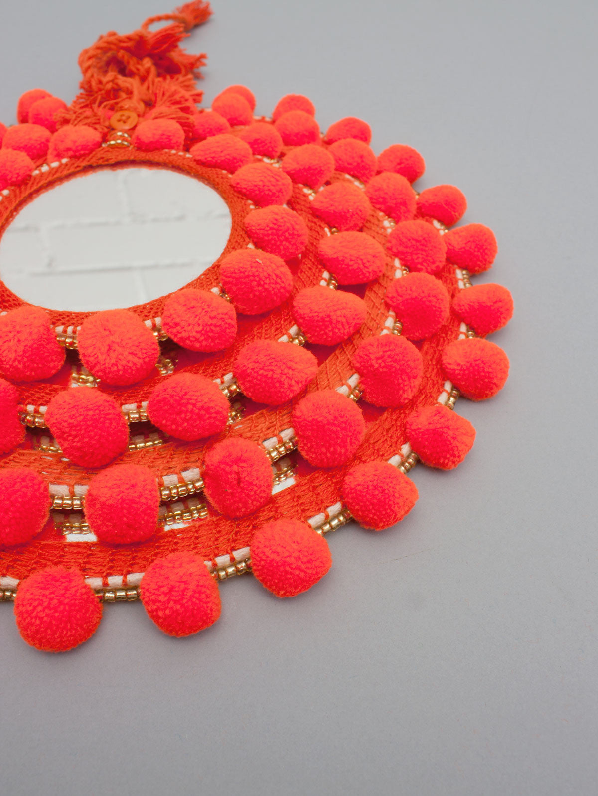 Orange Pom Pom Wall Mirror - Boho Home Decor for Bedroom, Living Room & Nursery - Handmade Decorative Mirror with Tassels