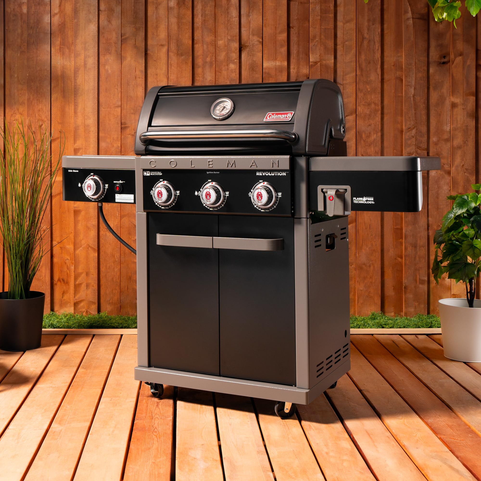 **Coleman Revolution 3-Burner 45,000 BTU Portable Propane Gas Grill with Side Burner – 650 Sq. In. Cooking Surface, Flare-Free Grates & 4-Wheel Cart – Black/Gray – Ideal for Camping, Tailgating & Backyard BBQs**