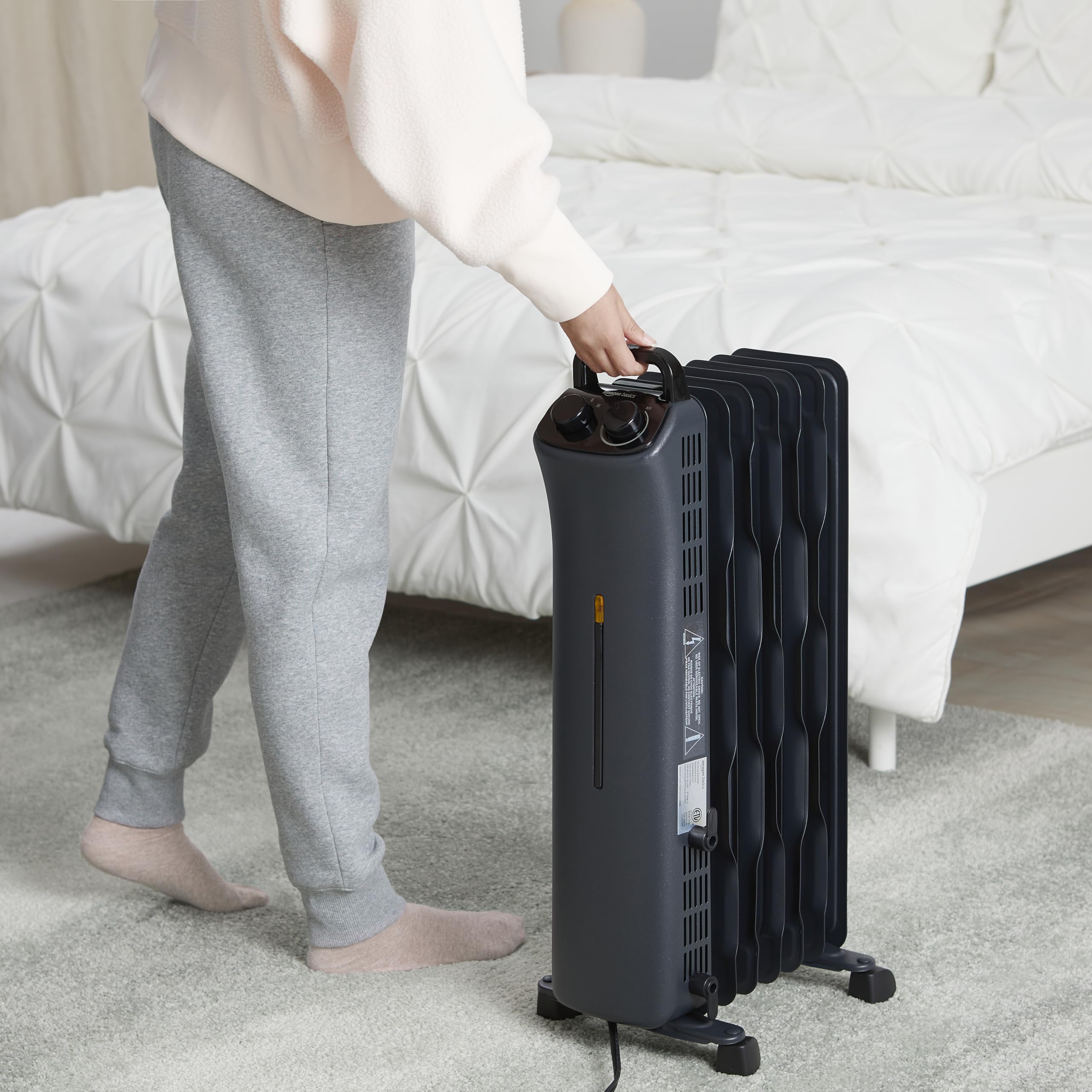 Amazon Basics 1500W Oil Filled Radiator Heater - Portable Space Heater with 7 Oil-Filled Fins, 3 Heat Settings & Thermostat - Tip-Over Protection & ETL Certified - Manual Control Indoor Heater for Bedroom, Office, Living Room - Black
