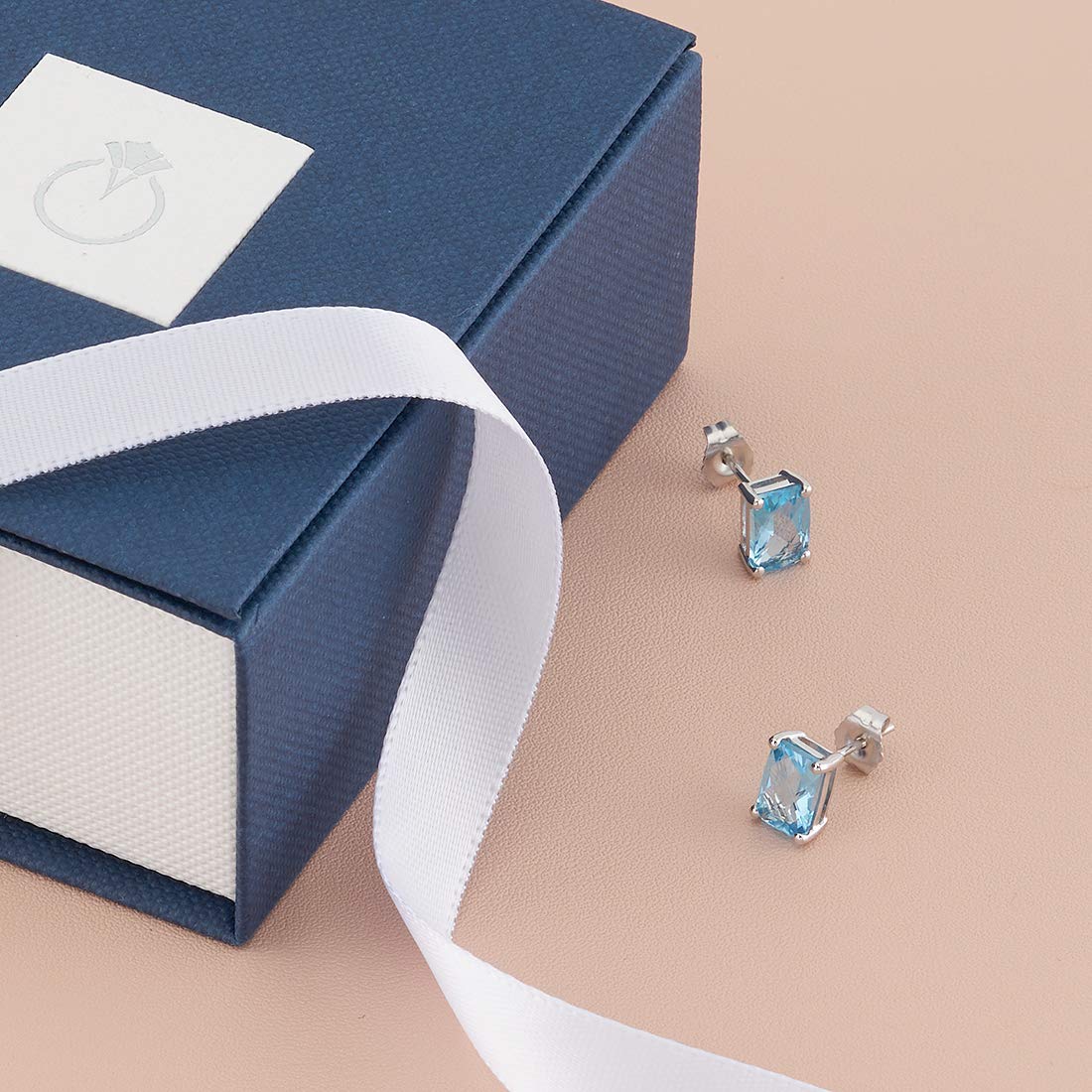 Peora 14K White Gold Swiss Blue Topaz Stud Earrings for Women – Genuine 7x5mm Radiant Cut Gemstone (2.25ct Total) with Secure Friction Back – December Birthstone Jewelry – Perfect for Weddings, Anniversaries & Special Occasions